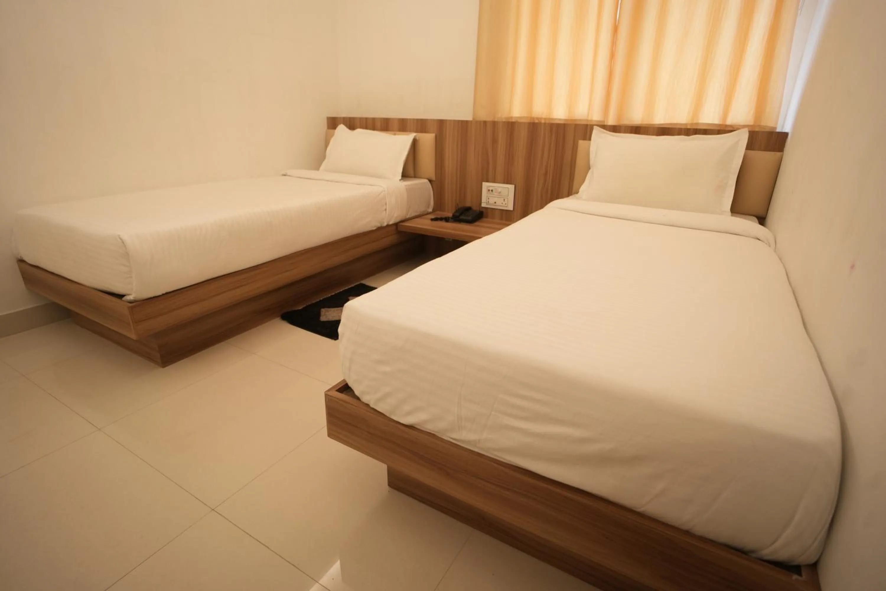 Bed in Hotel Shanti International