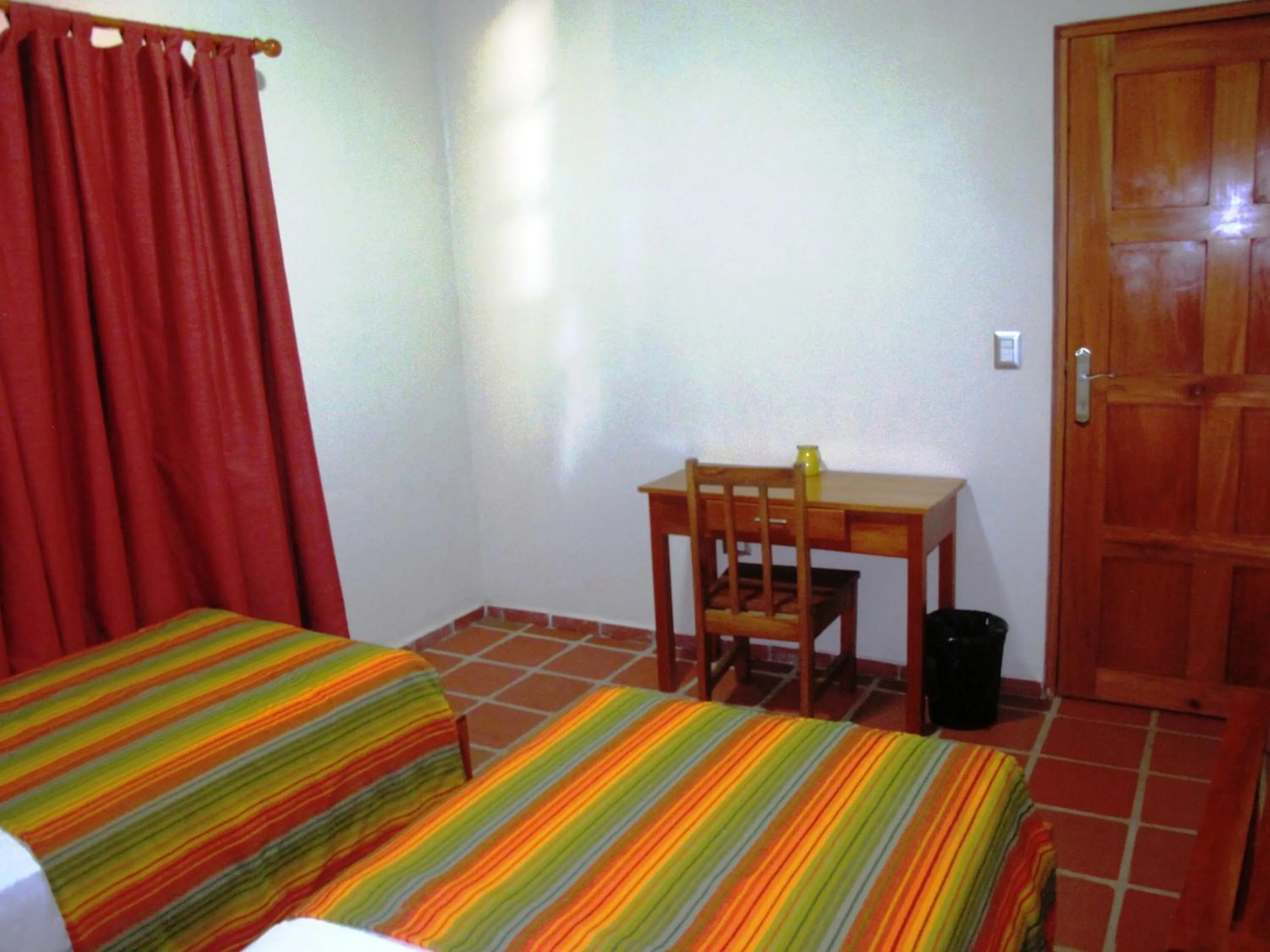 Bed in Hotel Iguanito