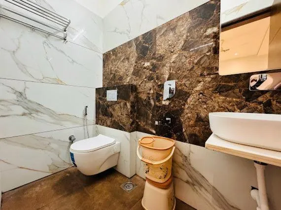 Bathroom in Hotel Rajdev INN