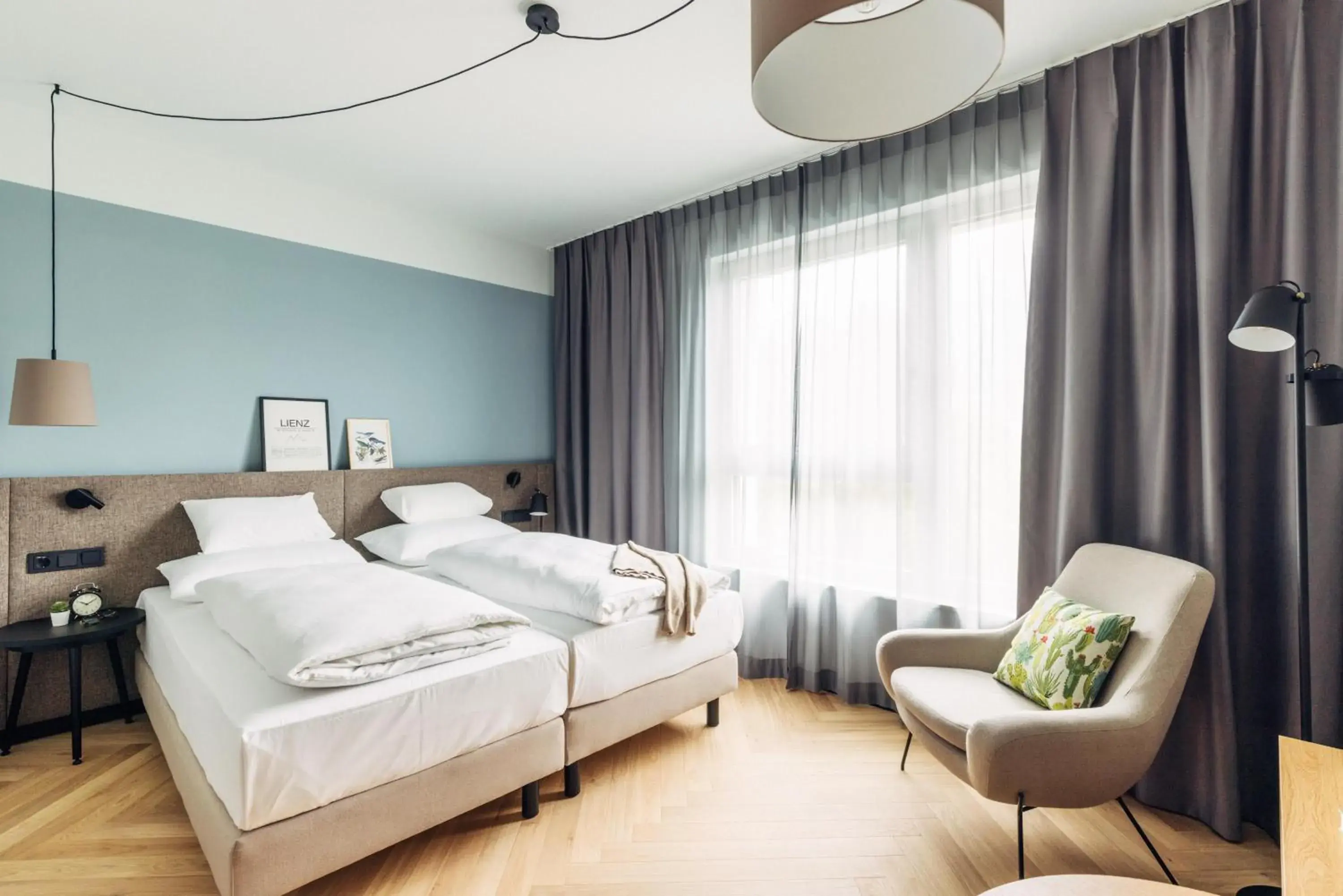 Photo of the whole room, Bed in harry's home Lienz hotel & apartments Photo of the whole room, Bed in harry's home Lienz hotel & apartments