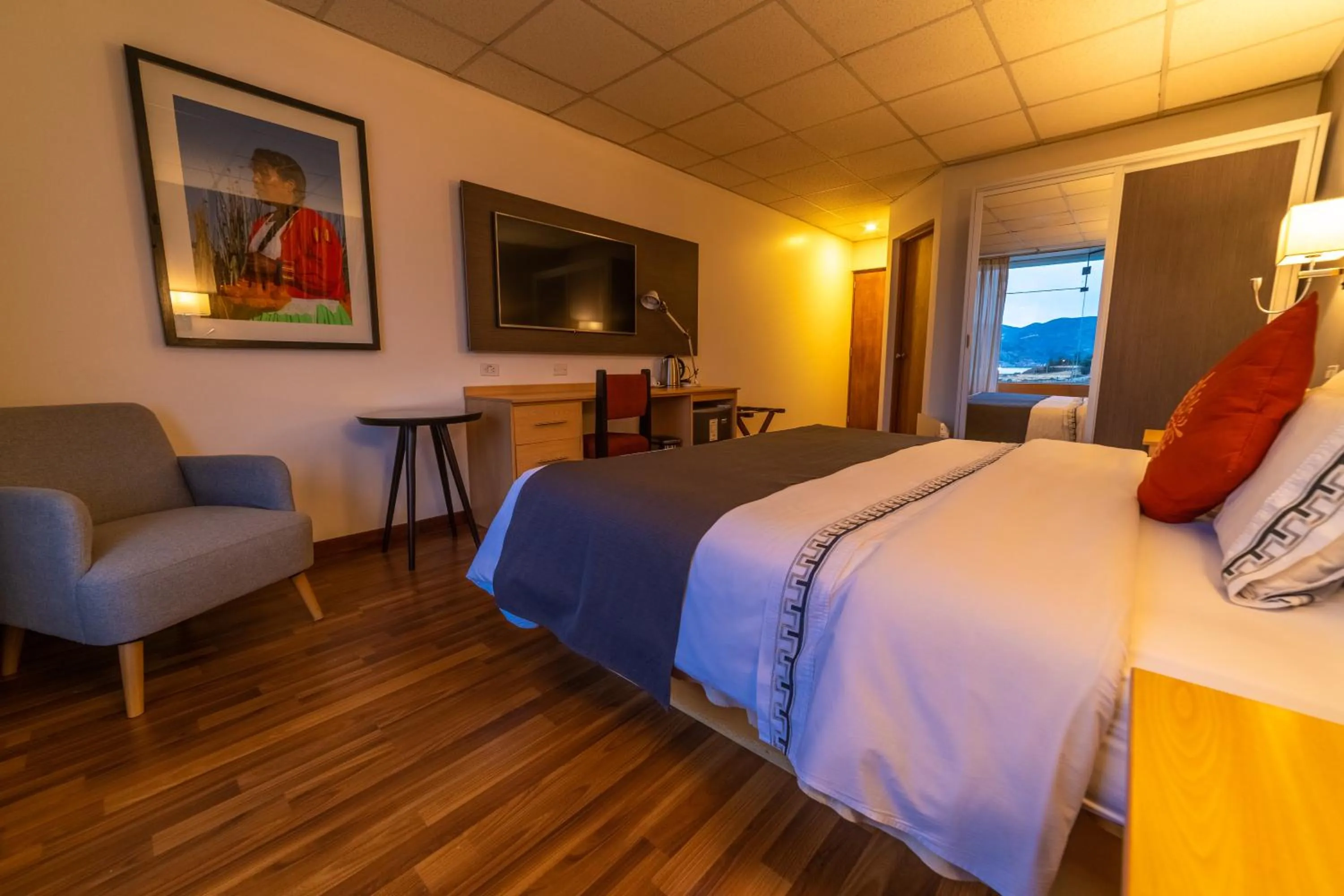 Photo of the whole room, Bed in Lake Titicaca Hotel