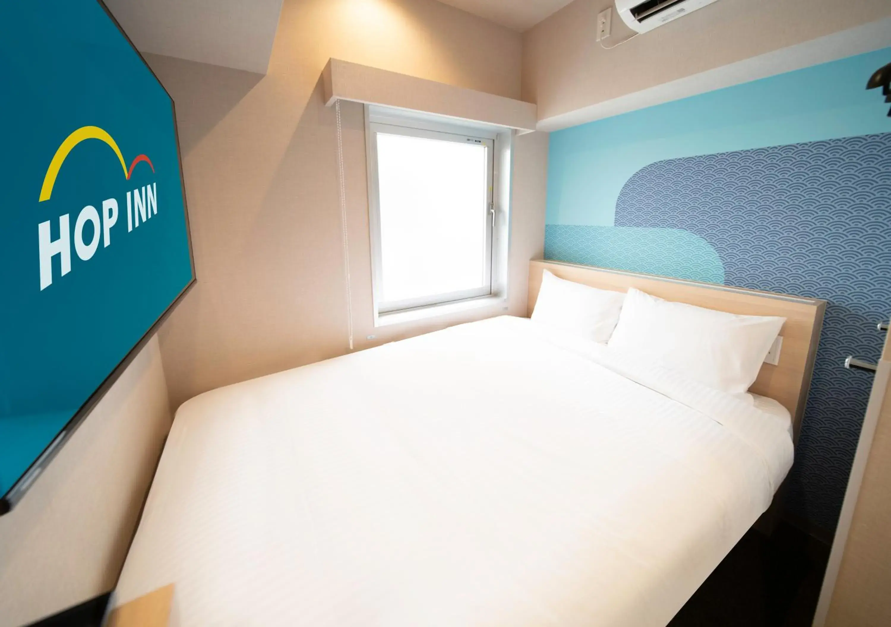 Bed in Hop Inn Tokyo Ueno Bed in Hop Inn Tokyo Ueno