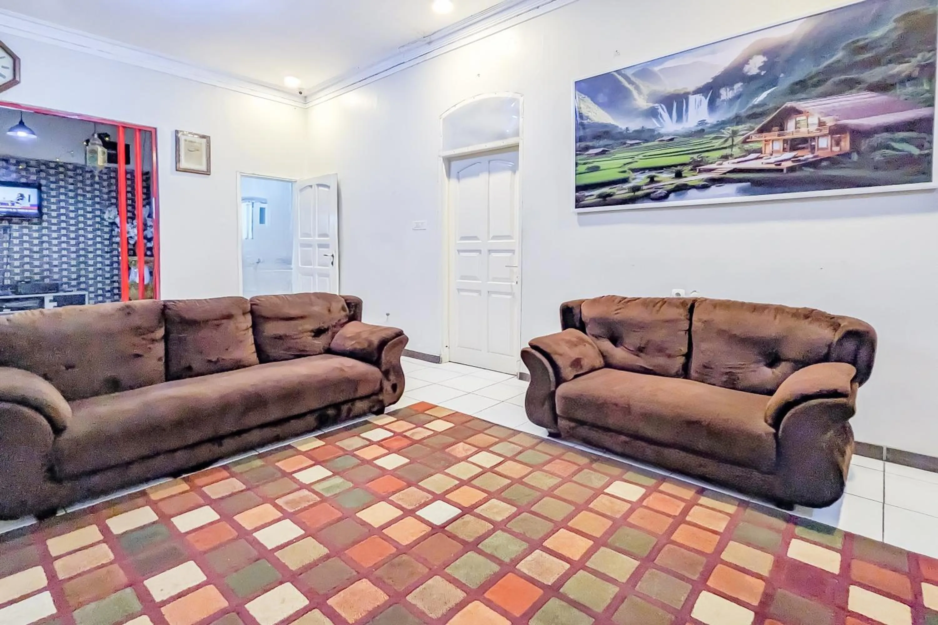 Seating area in Urbanview Alza by RedDoorz