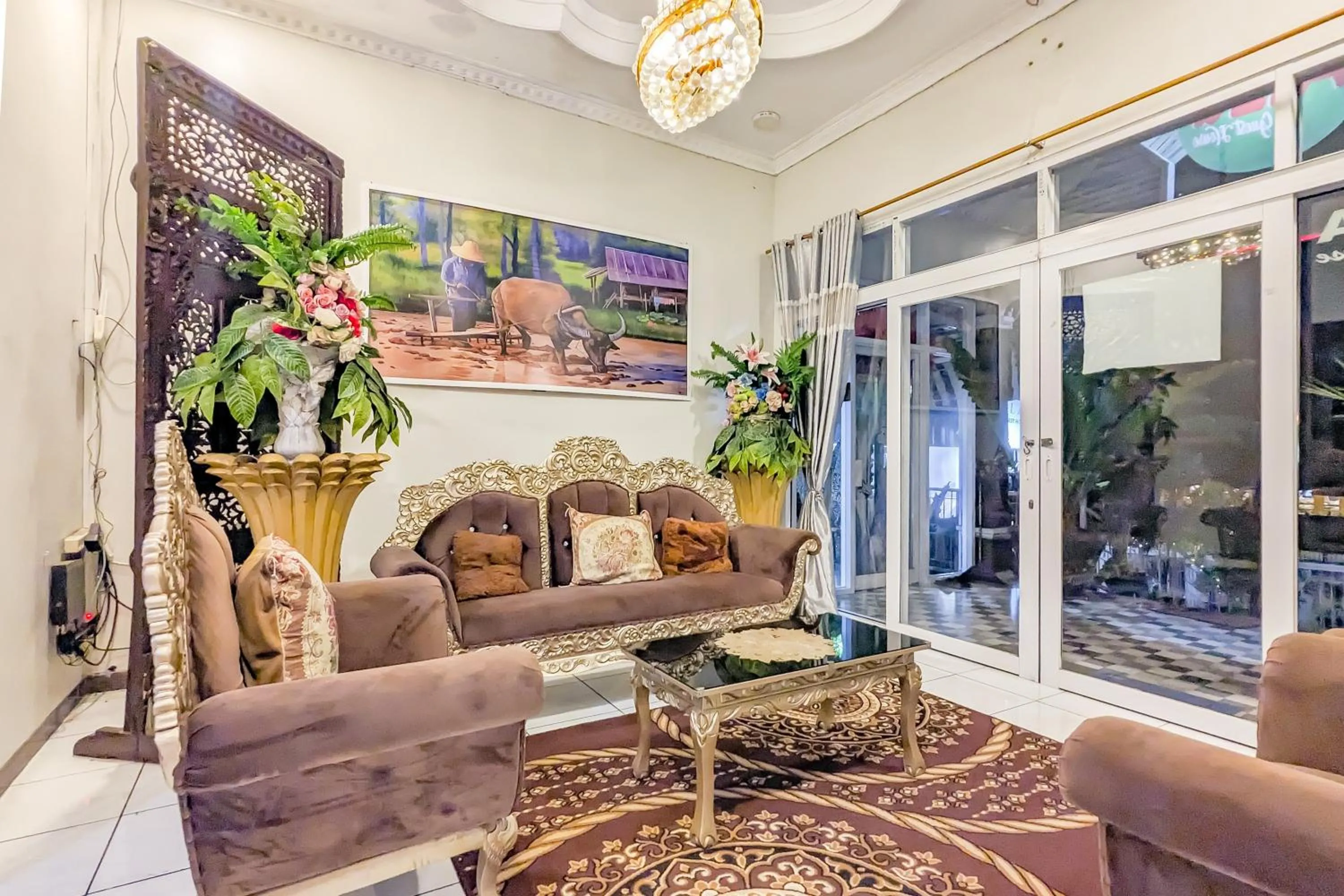 Seating area in Urbanview Alza by RedDoorz