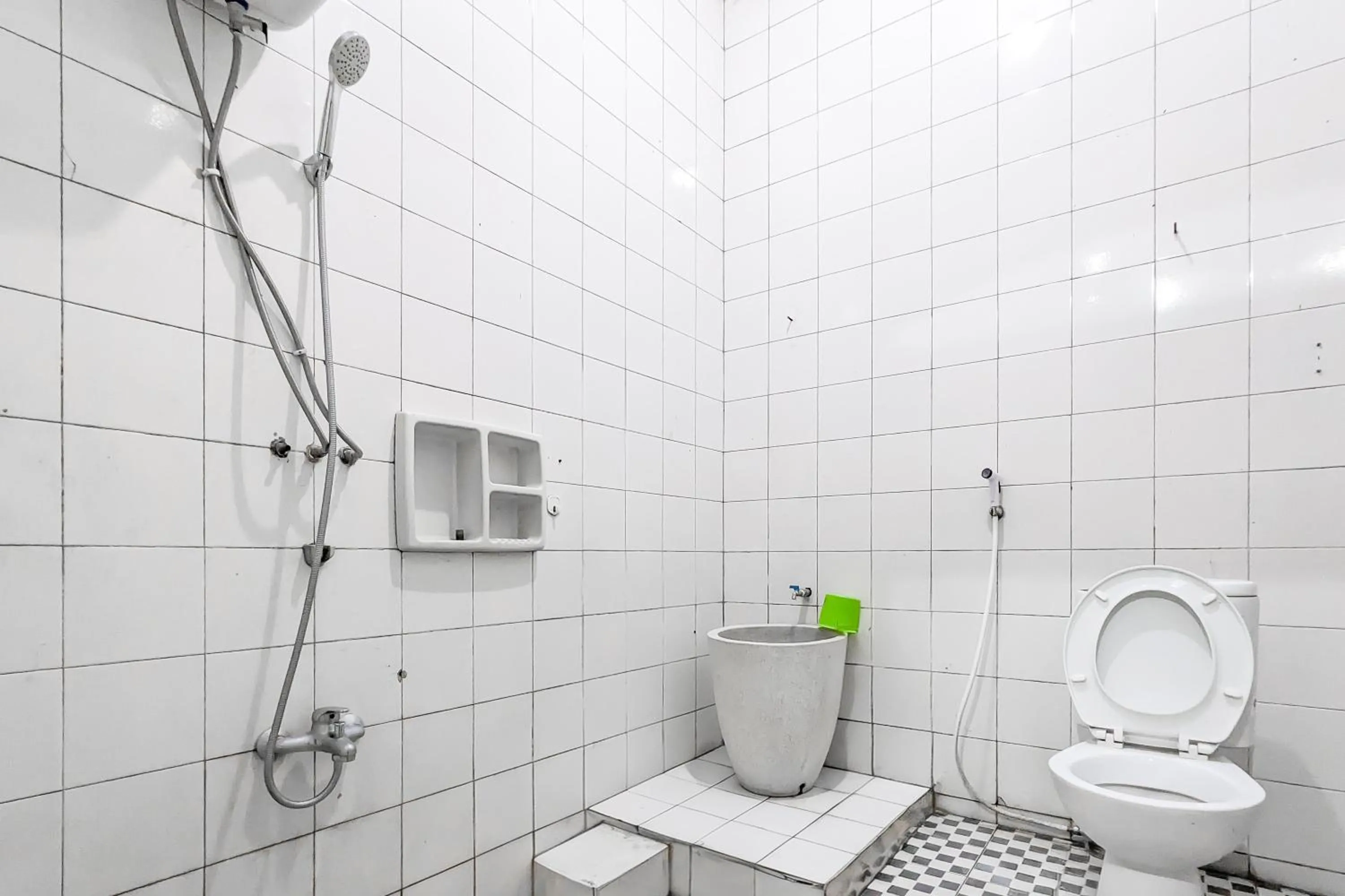 Bathroom in Urbanview Alza by RedDoorz