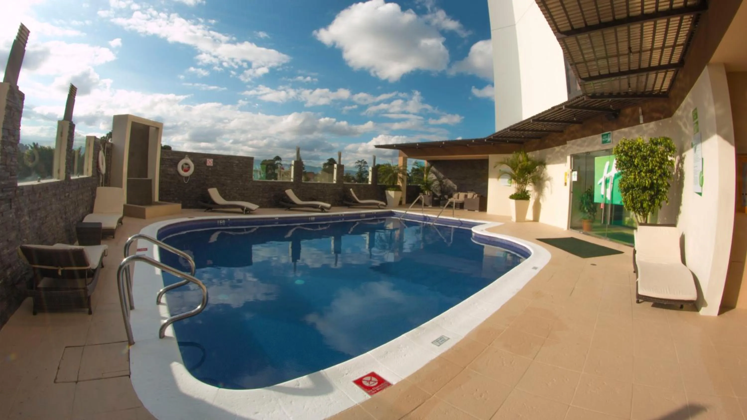 Swimming pool in Holiday Inn Guatemala by IHG