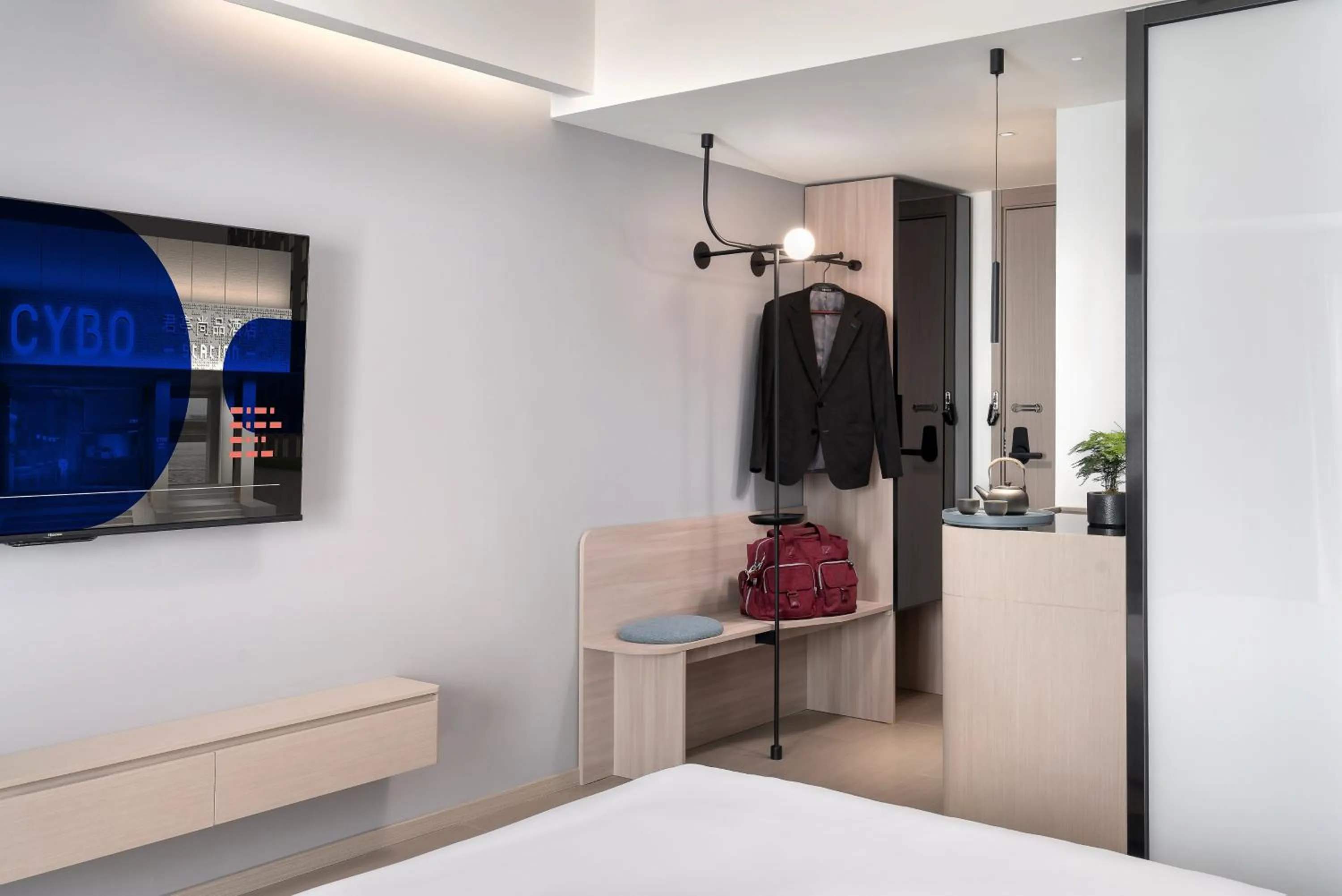 wardrobe, Bed in CYBO Station SSAW Shangpin Hotel Luohu Shenzhen