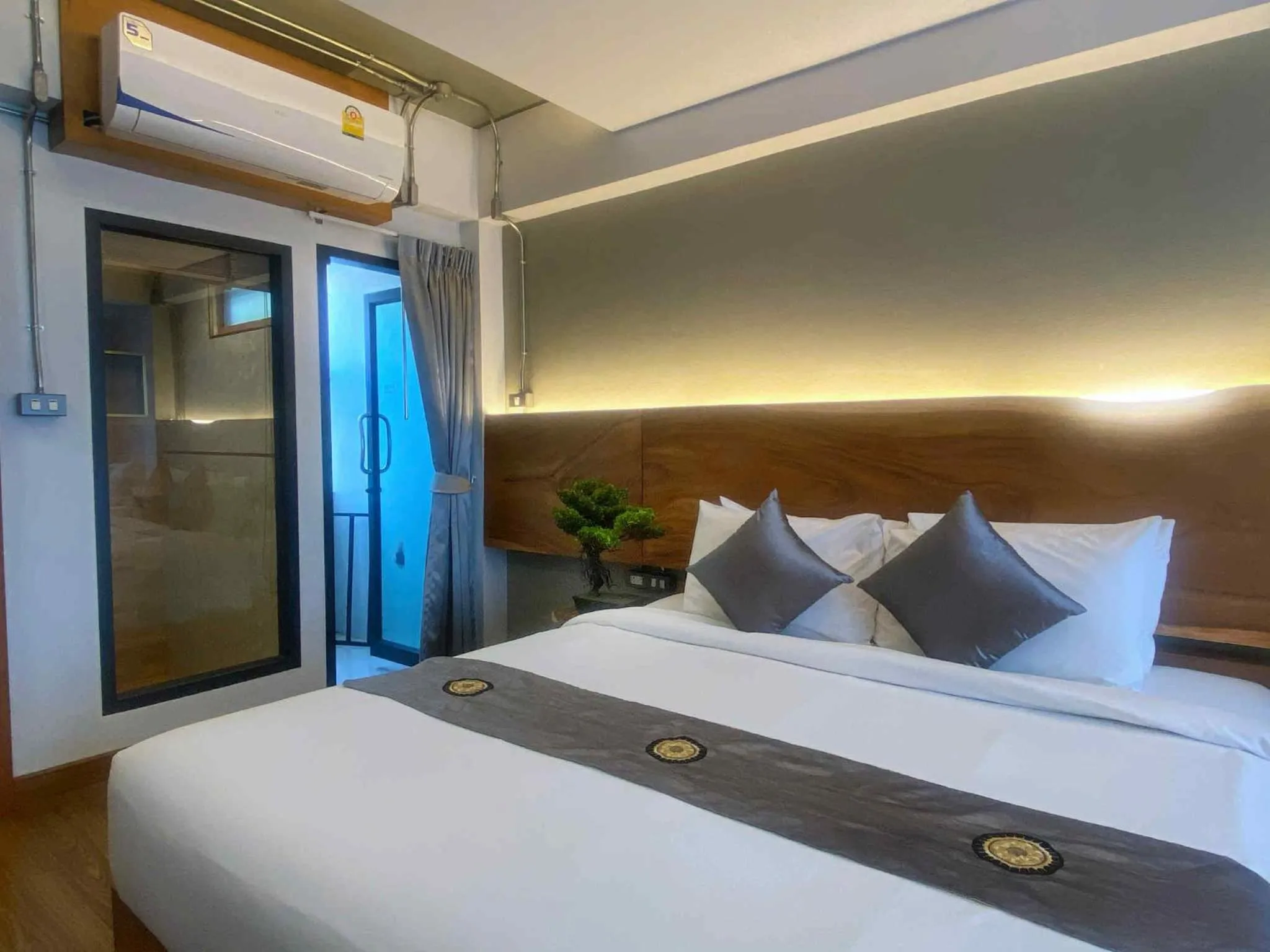 Bed in Lanna Tree Boutique Hotel