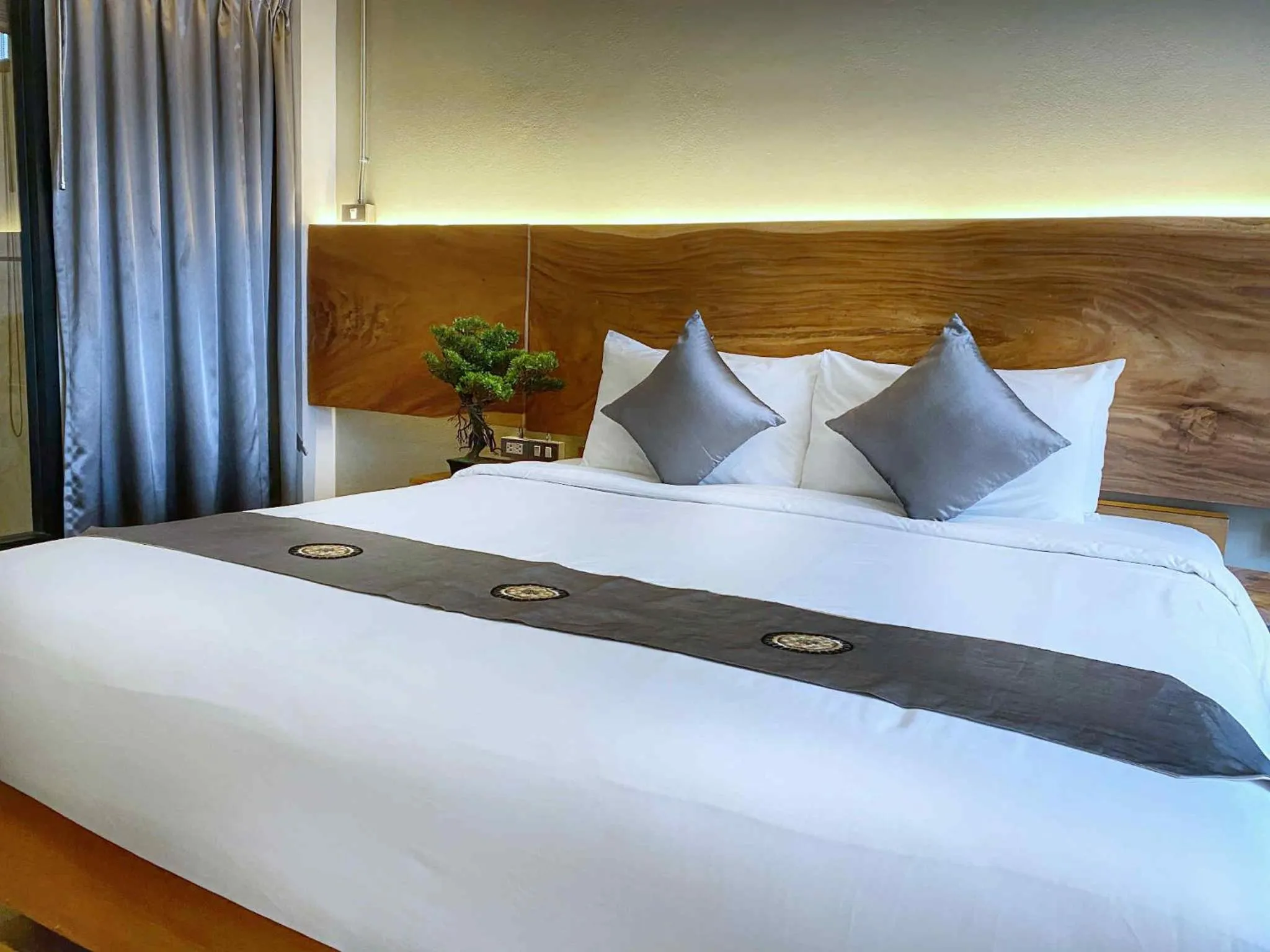 Bed in Lanna Tree Boutique Hotel