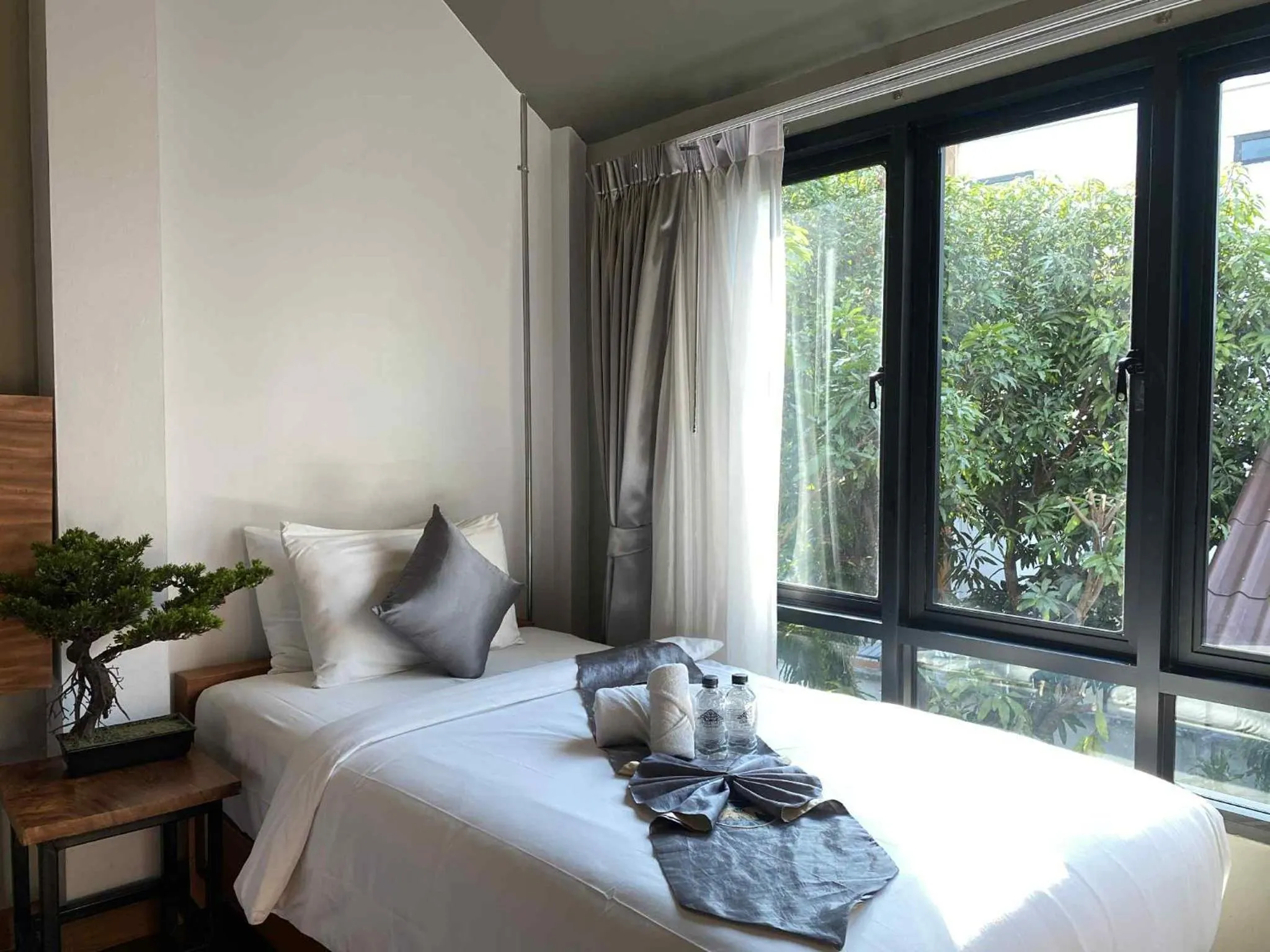 Bed in Lanna Tree Boutique Hotel