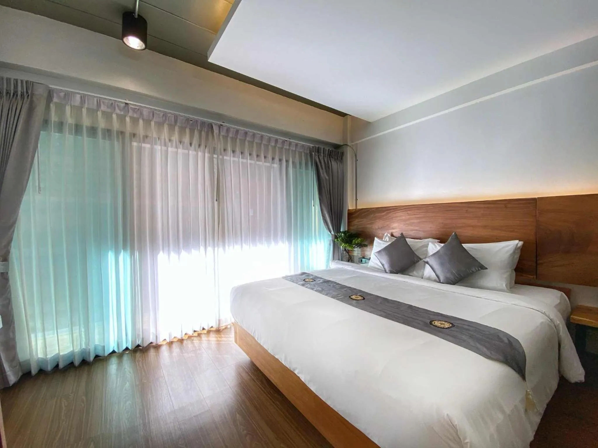 Bed in Lanna Tree Boutique Hotel