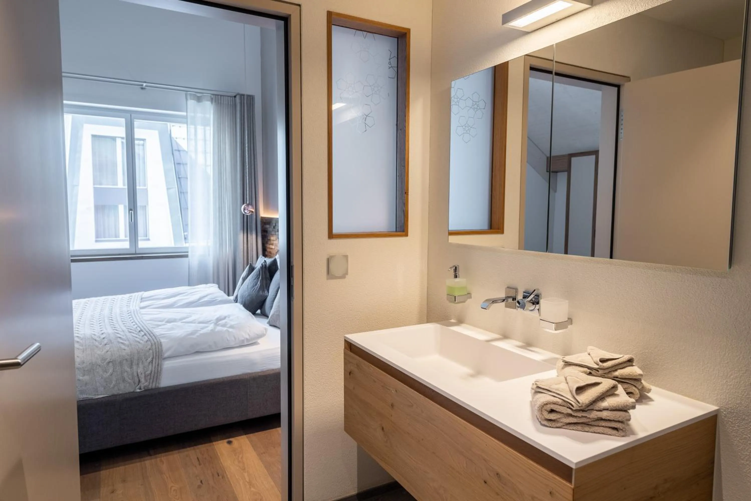 Bedroom, Bed in Andermatt Alpine Apartments