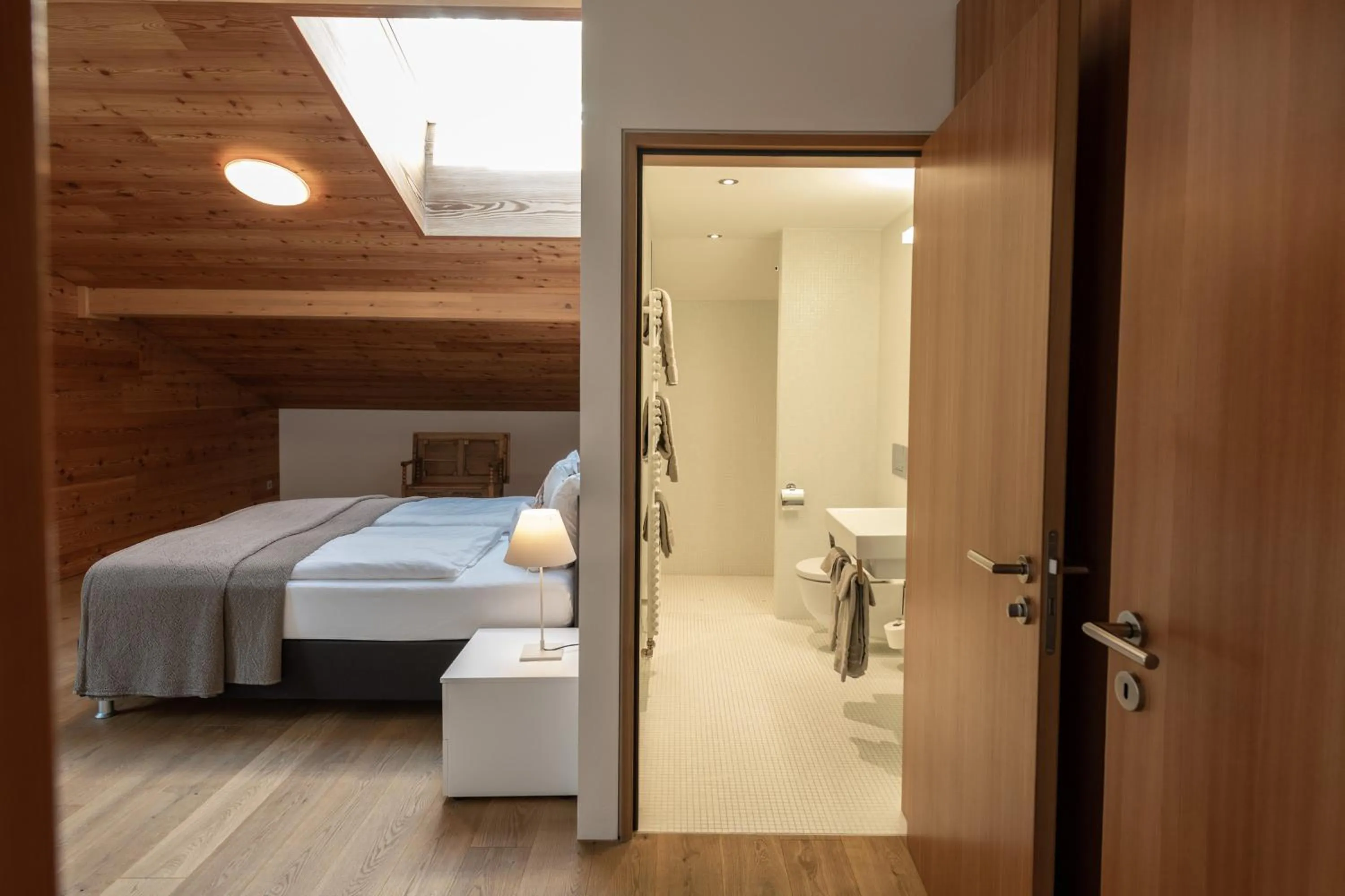 Bathroom, Bed in Andermatt Alpine Apartments
