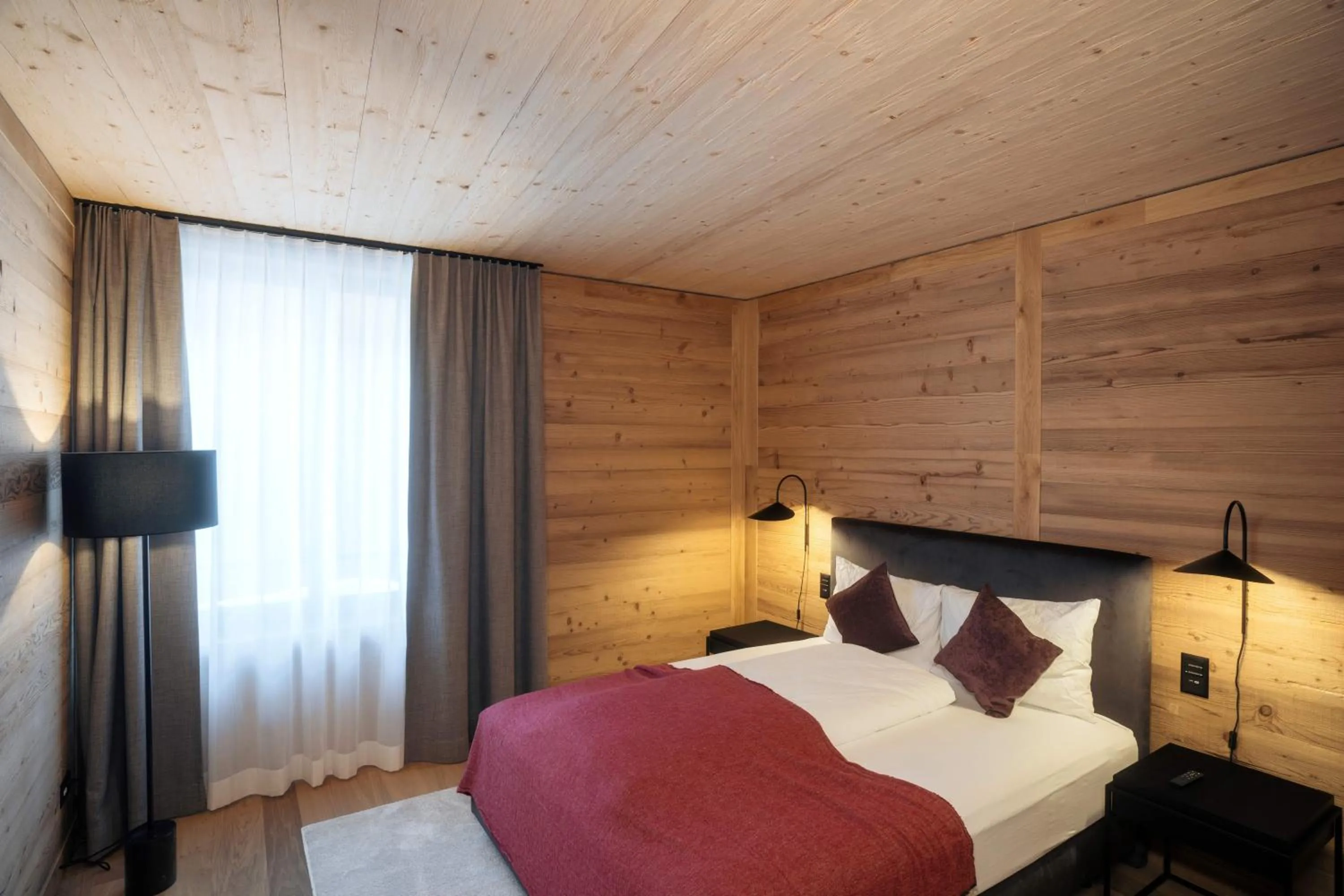 Bedroom, Bed in Andermatt Alpine Apartments