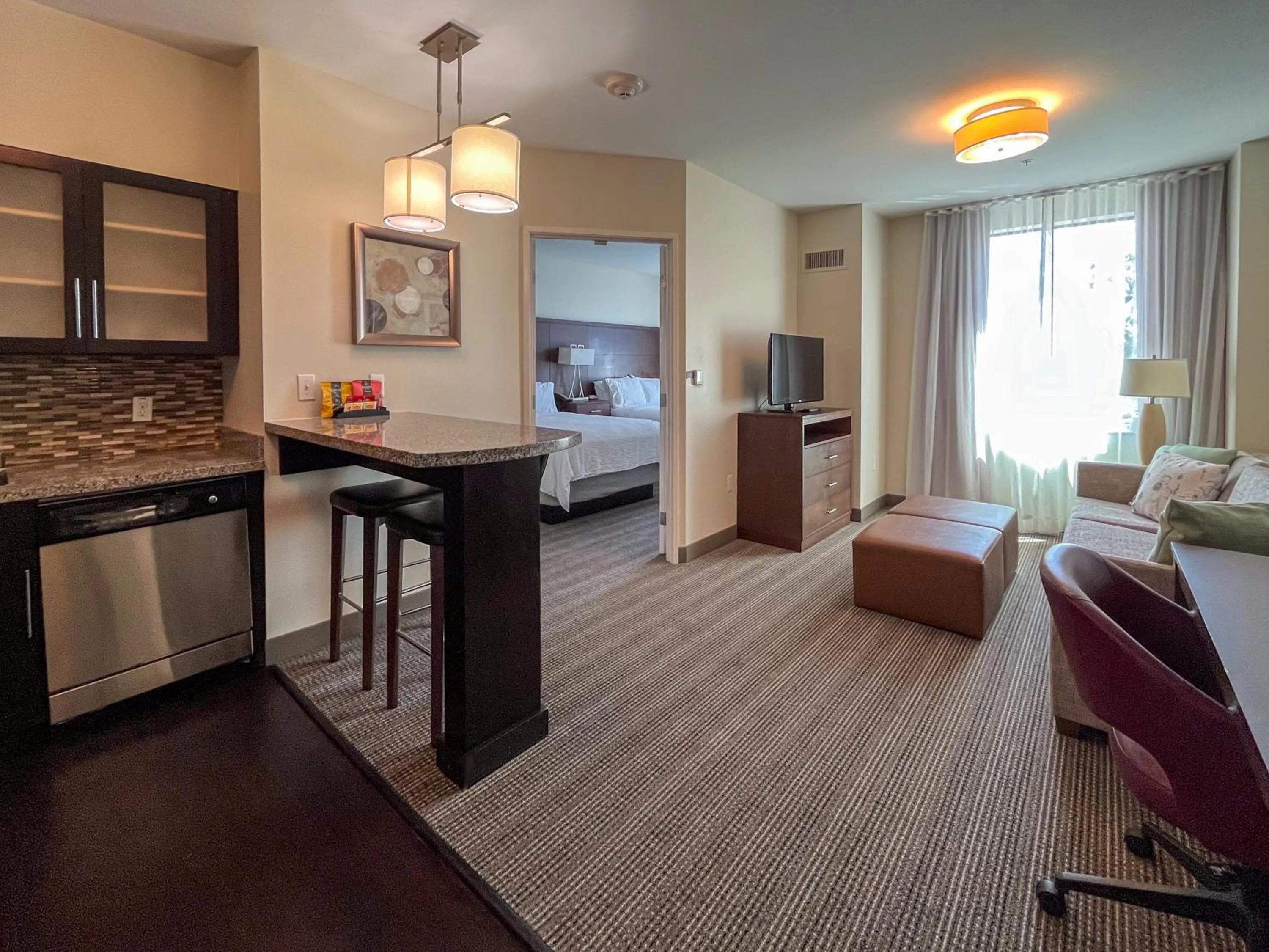 Dining area, Bed in Staybridge Suites Carlsbad/San Diego by IHG