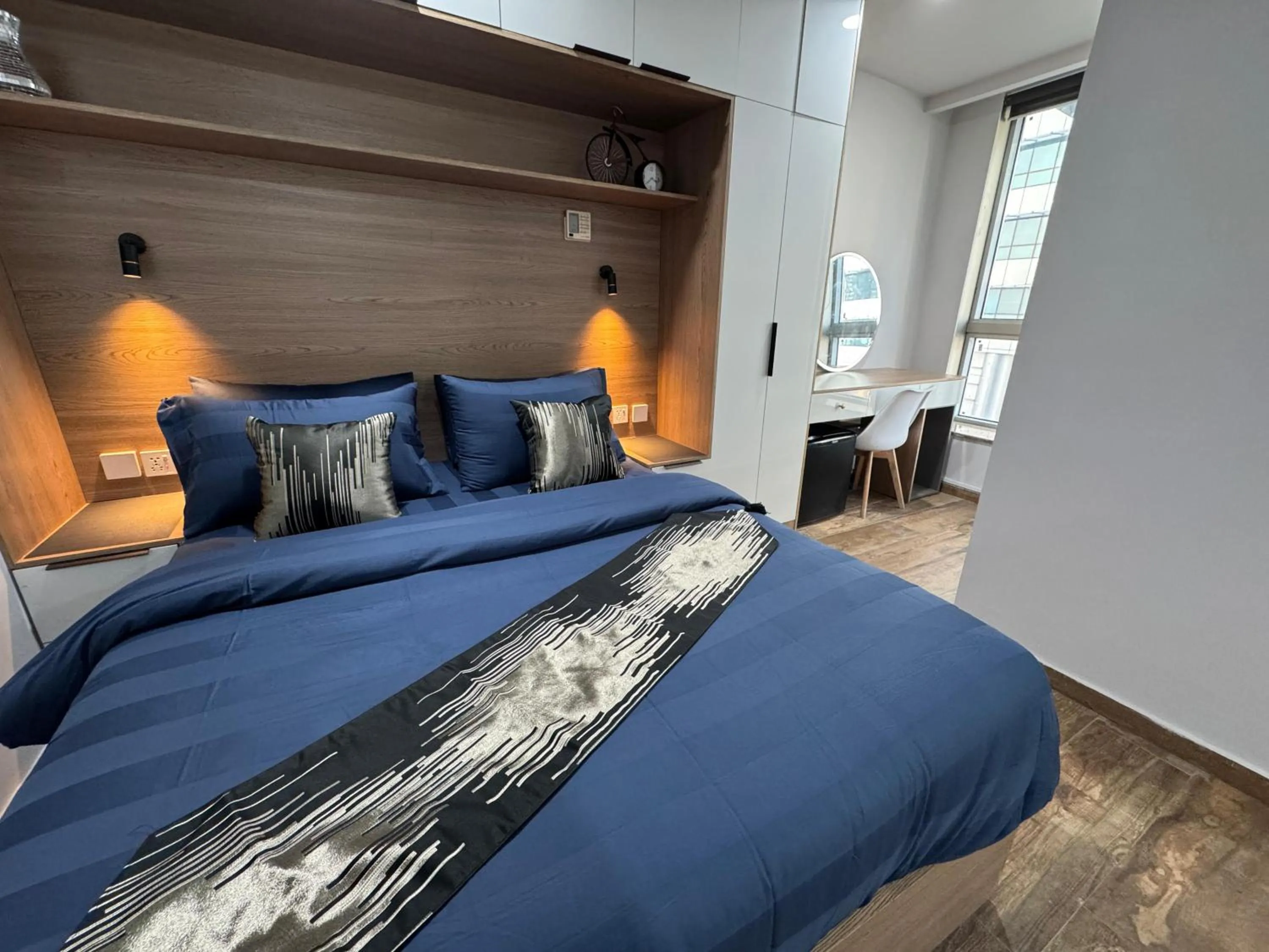 Photo of the whole room, Bed in The Centaurus Apartments