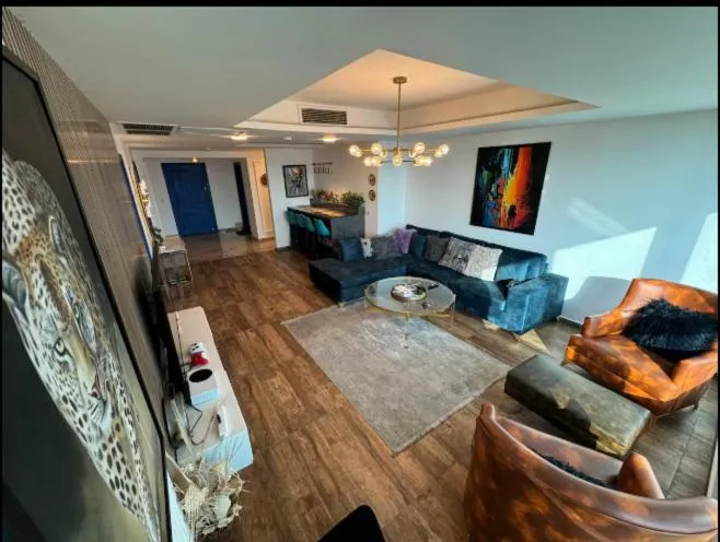 Communal lounge/ TV room in The Centaurus Apartments