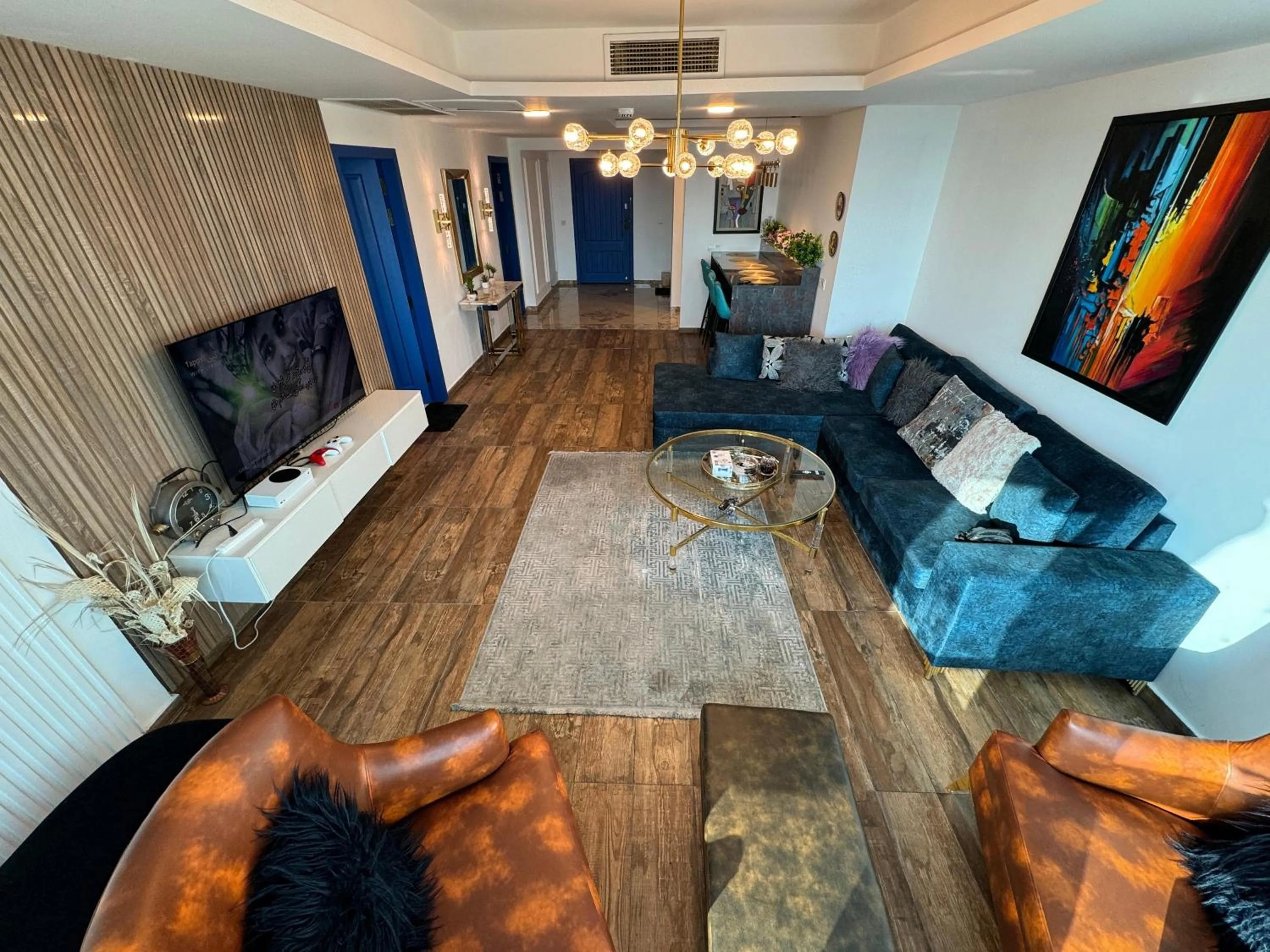 Communal lounge/ TV room in The Centaurus Apartments