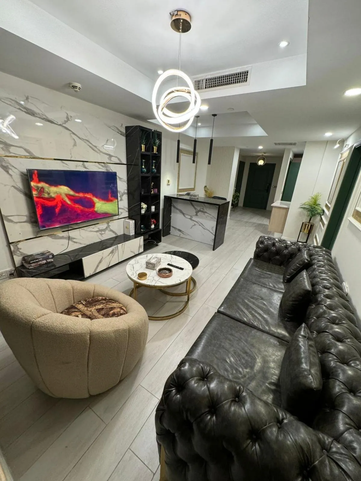 Communal lounge/ TV room in The Centaurus Apartments