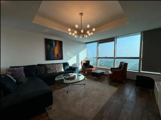 Communal lounge/ TV room in The Centaurus Apartments