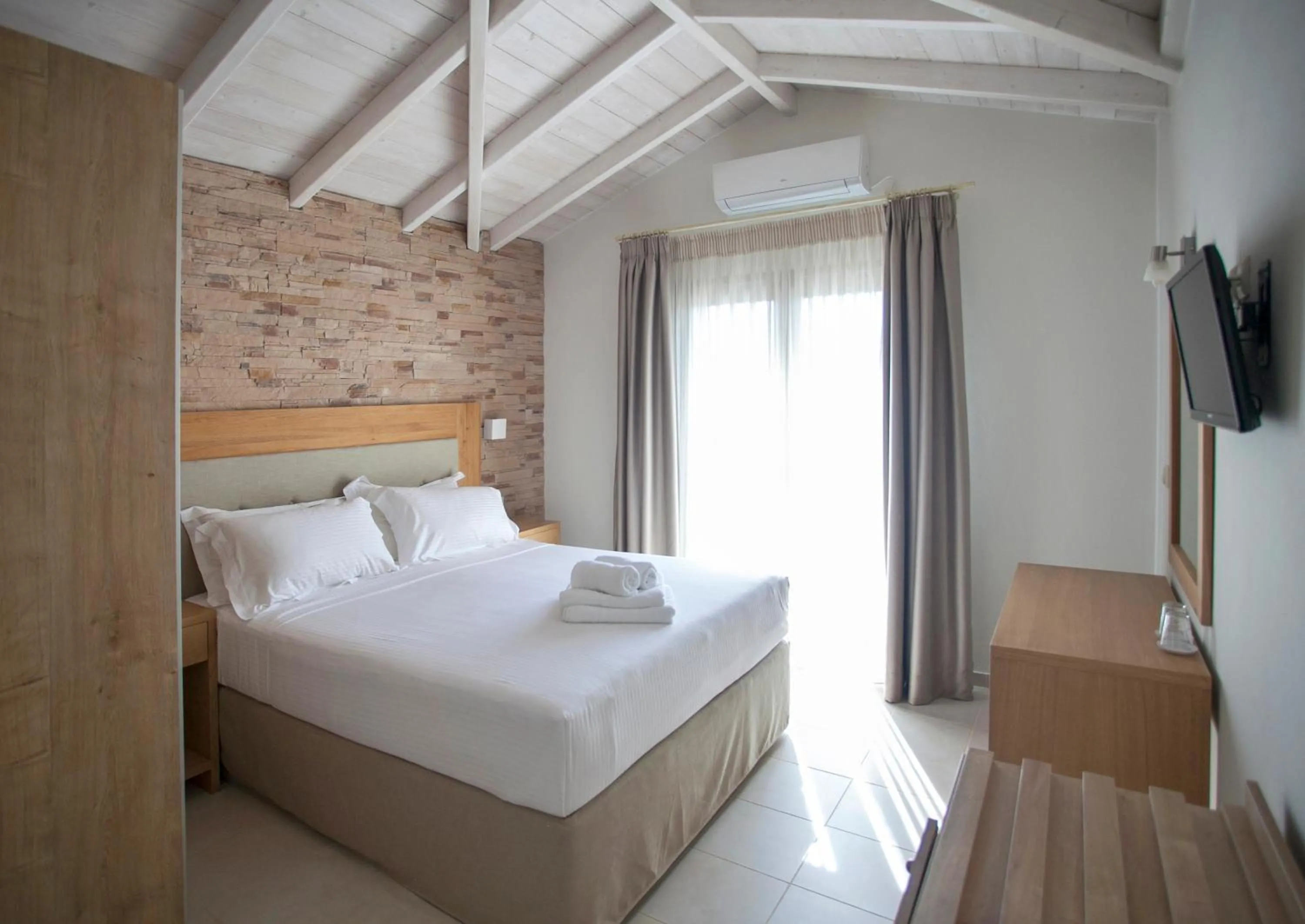 Bed in Aktaia Boutique Hotel