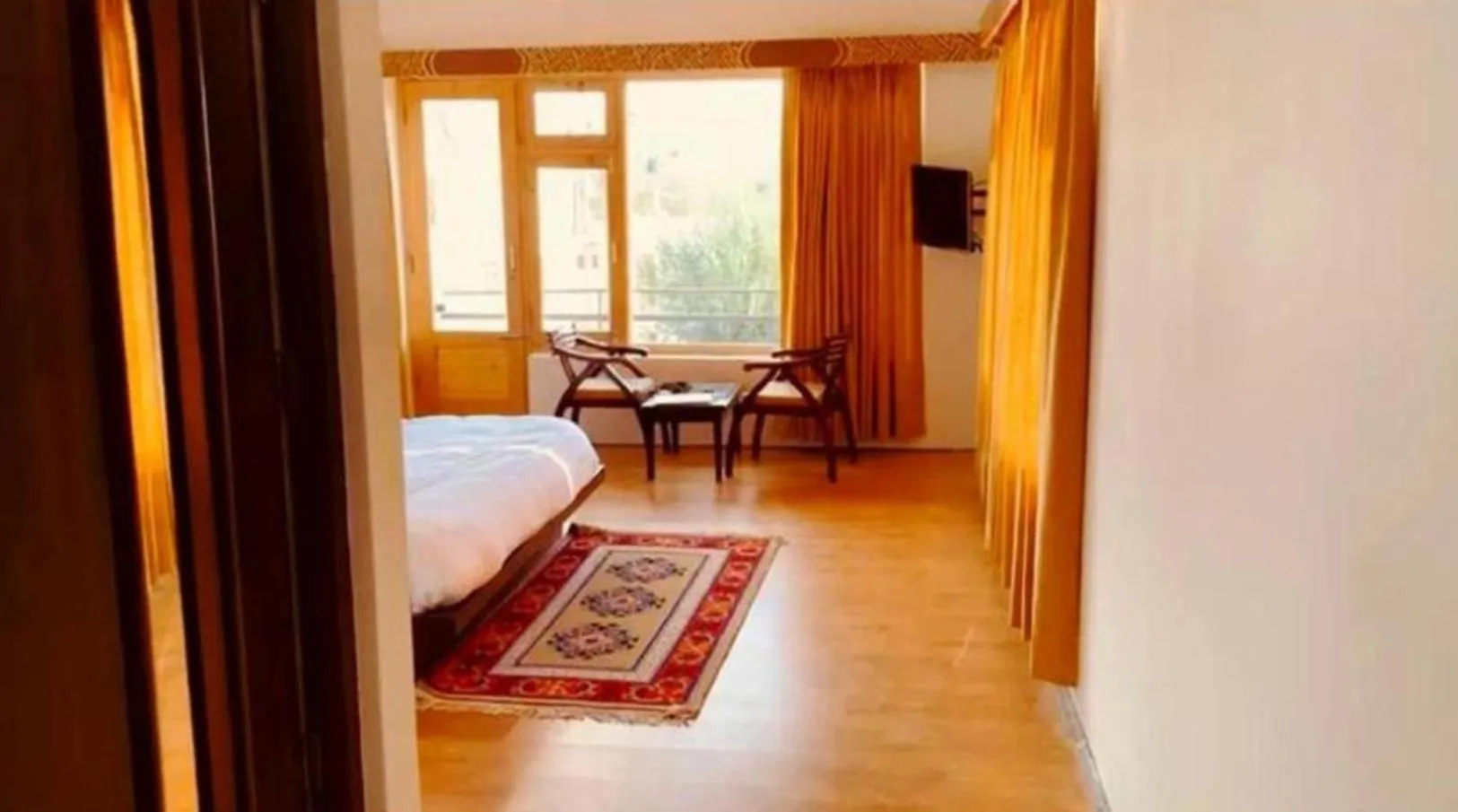 Seating area, Bed in Niran Boutique Hotel