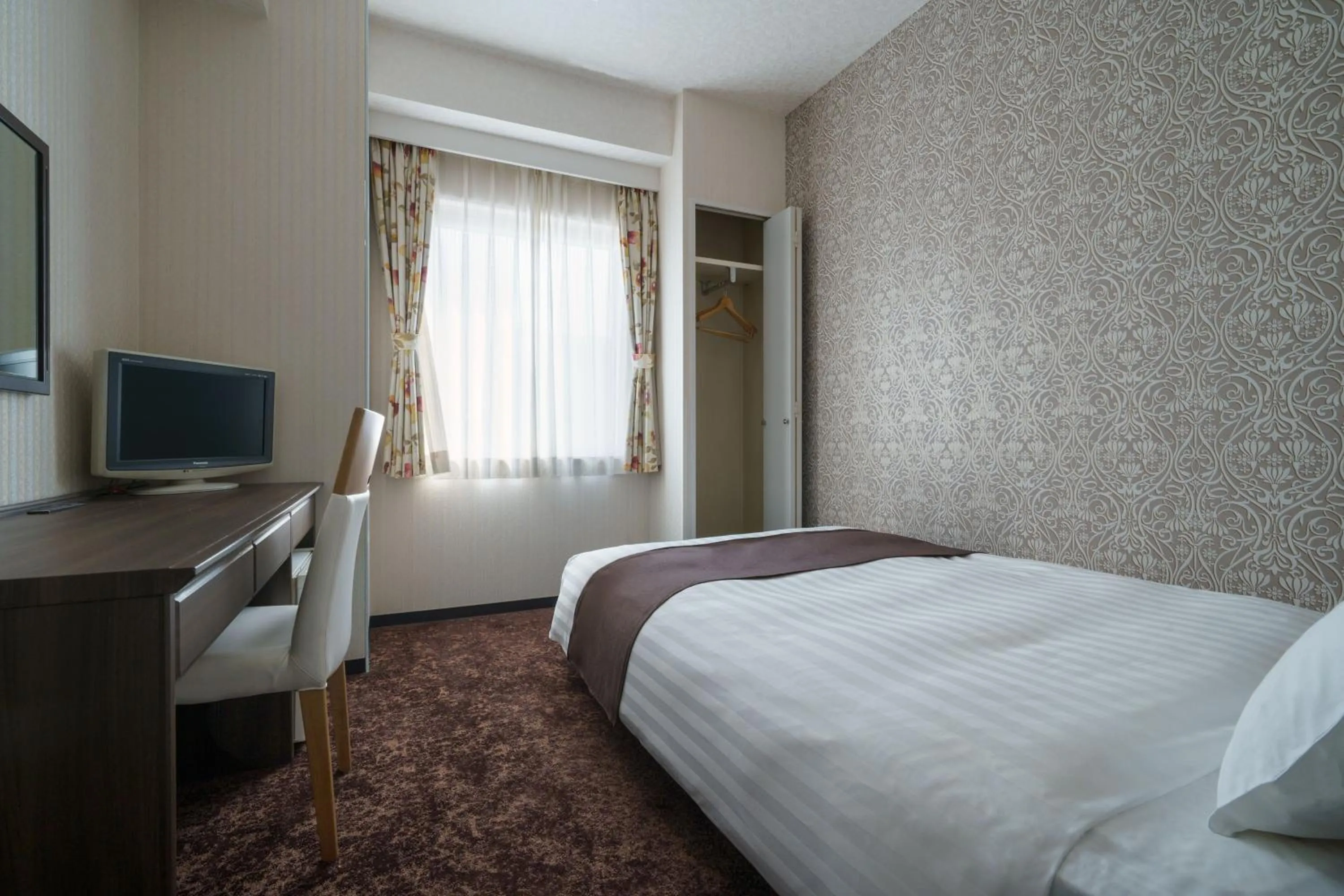 Bed in Hotel Centmain Nagoya