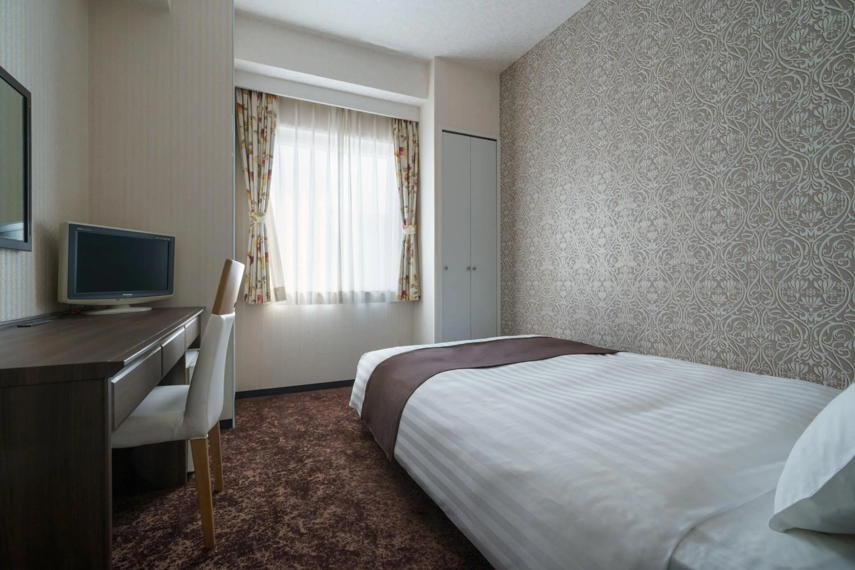 Bed in Hotel Centmain Nagoya