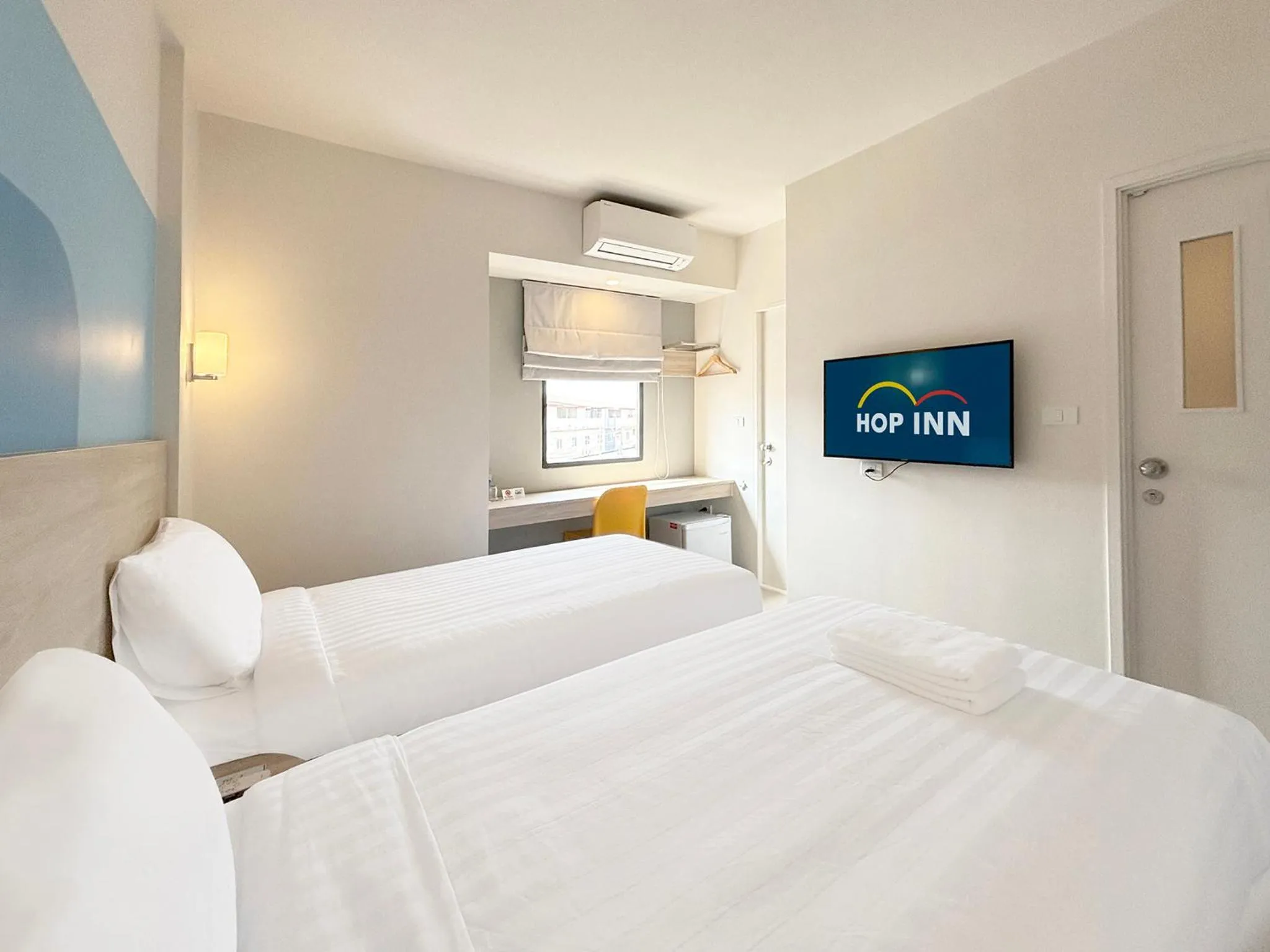 Bed in HOP INN Suphanburi