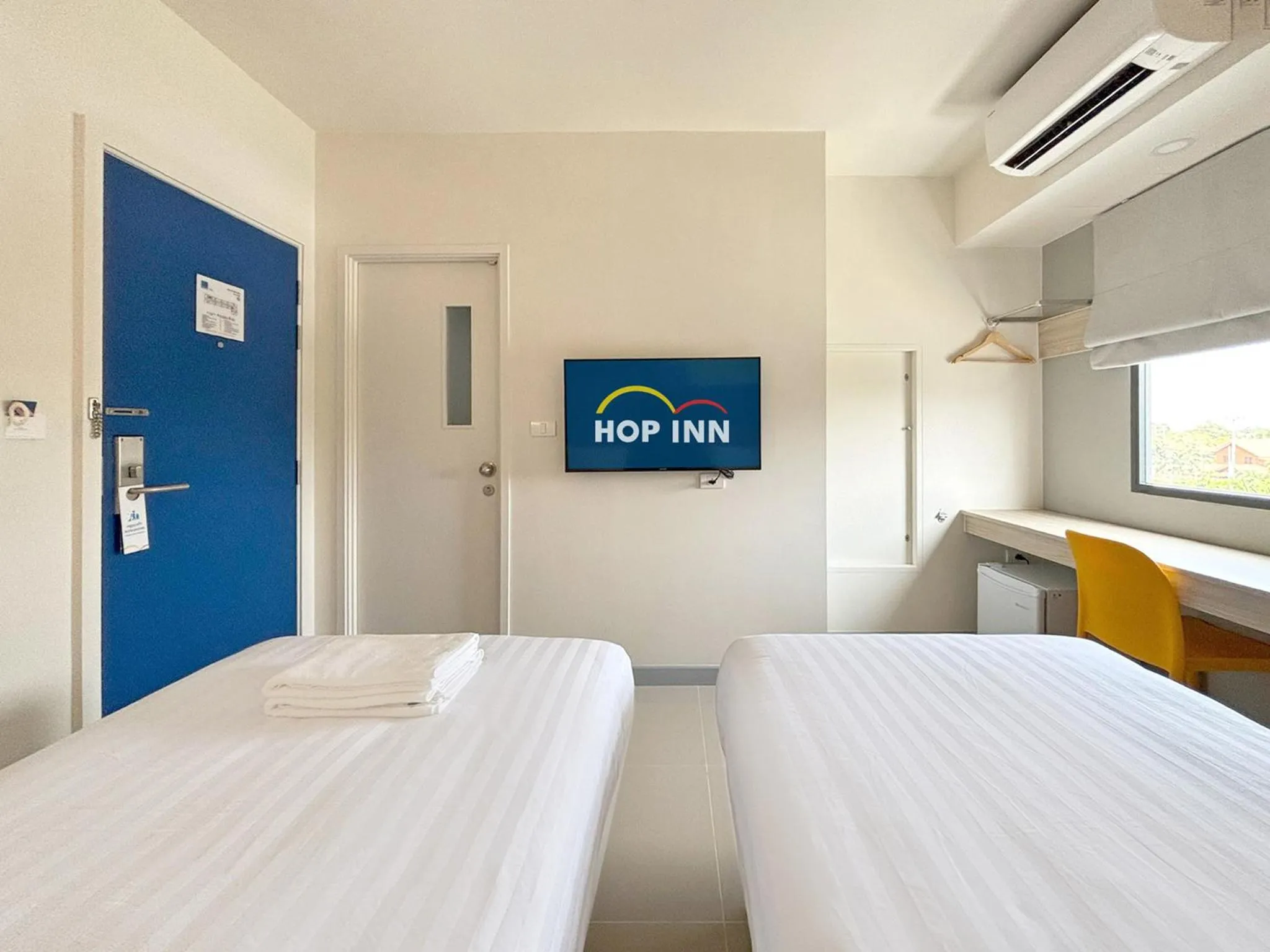 Bed in HOP INN Suphanburi