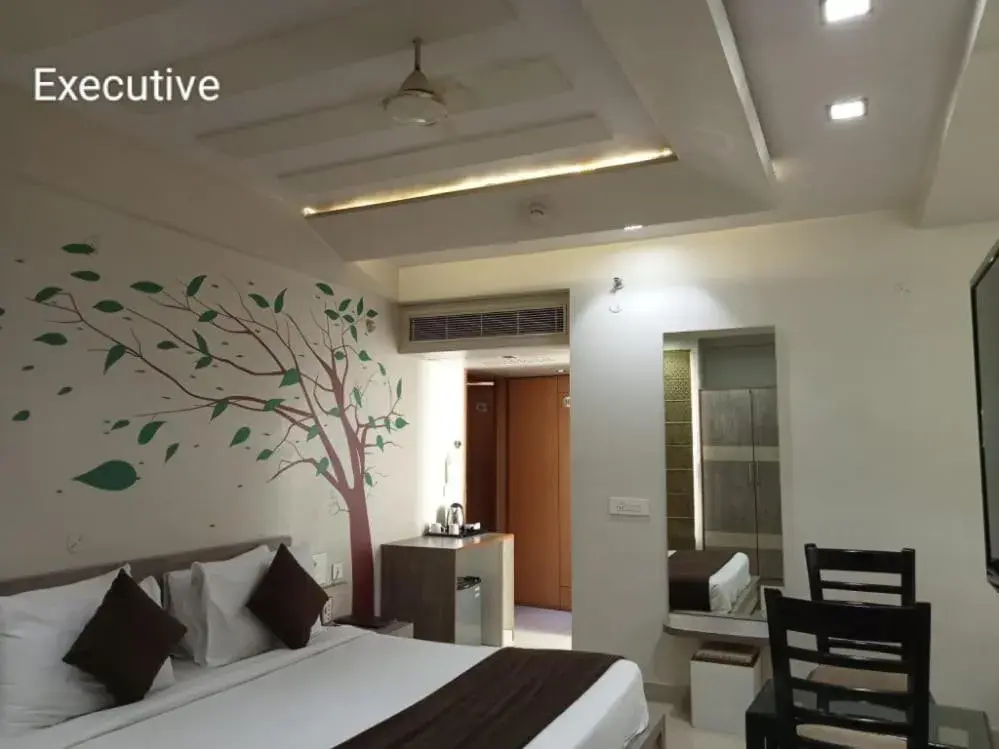 Bedroom in Hotel Yash Regency Bedroom in Hotel Yash Regency