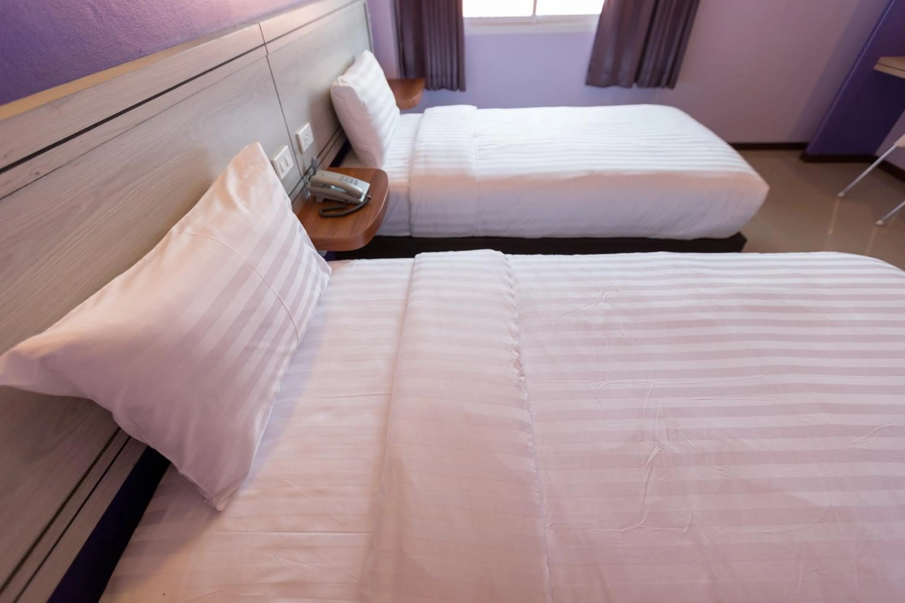 Bed in Thungtawan Hotel