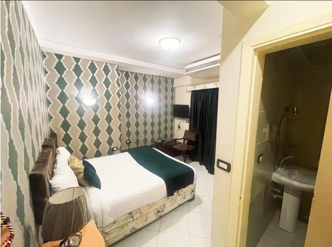 Bathroom, Bed in Golden Sun Hotel - Hurghada