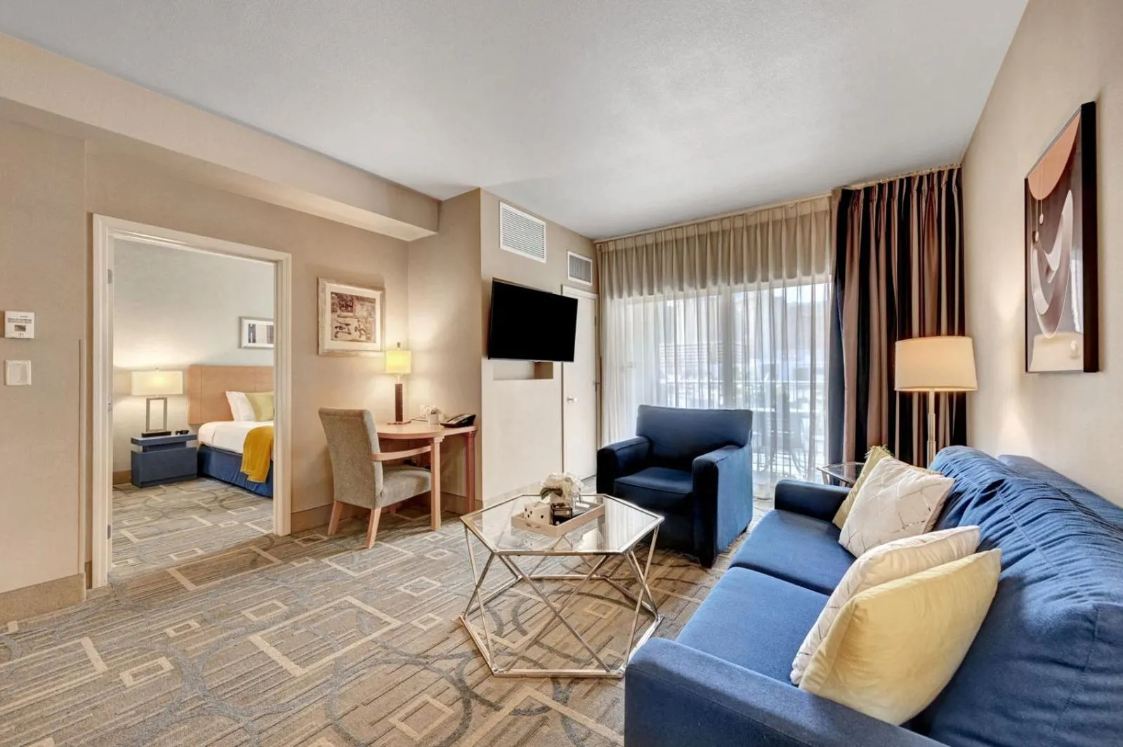 Living room, Bed in Royal Oasis Suite at Platinum Hotel-Strip Views