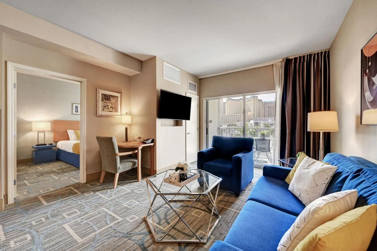 Living room, Bed in Royal Oasis Suite at Platinum Hotel-Strip Views