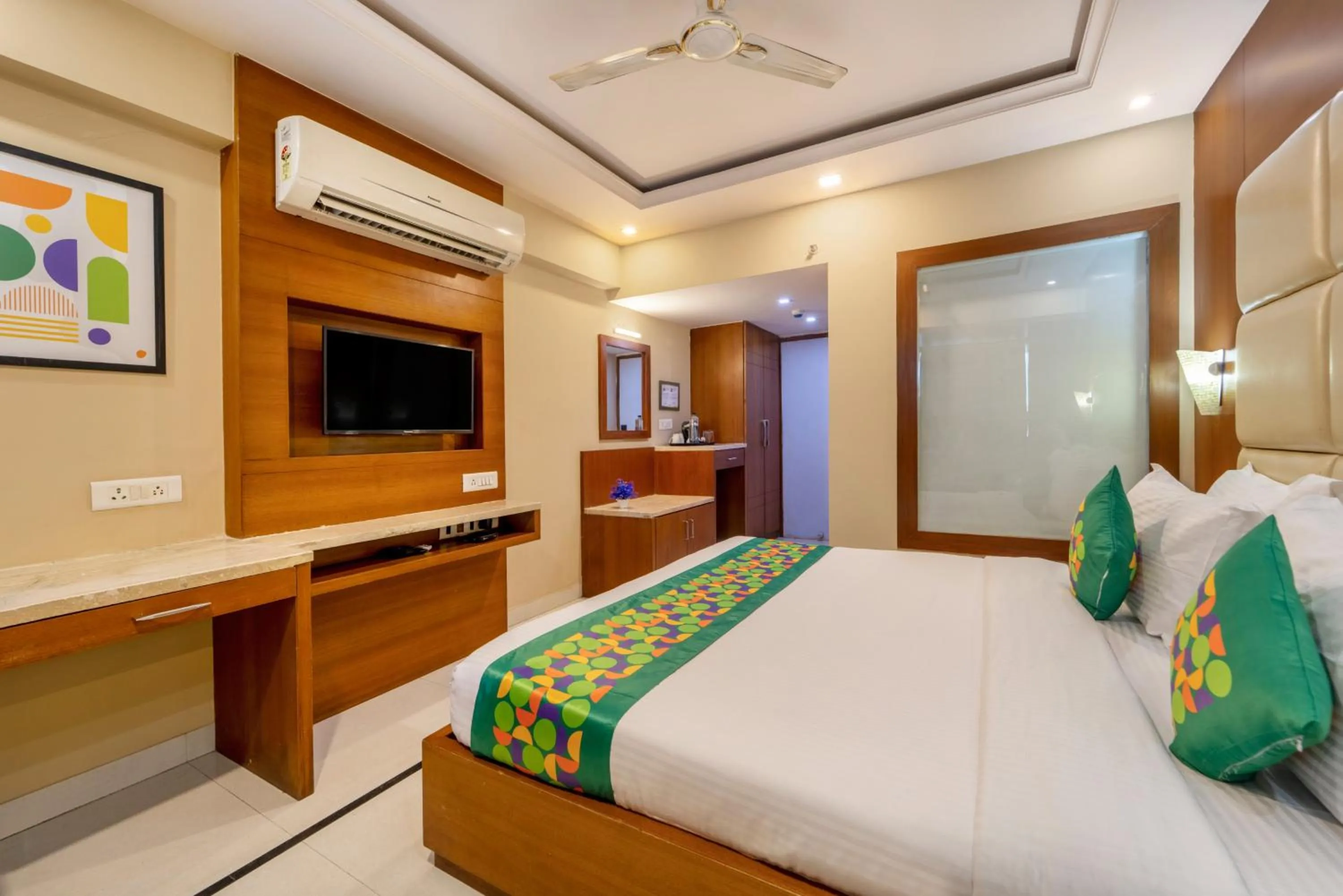 Bedroom, Bed in Treebo Premium Vinnie - Near Airport