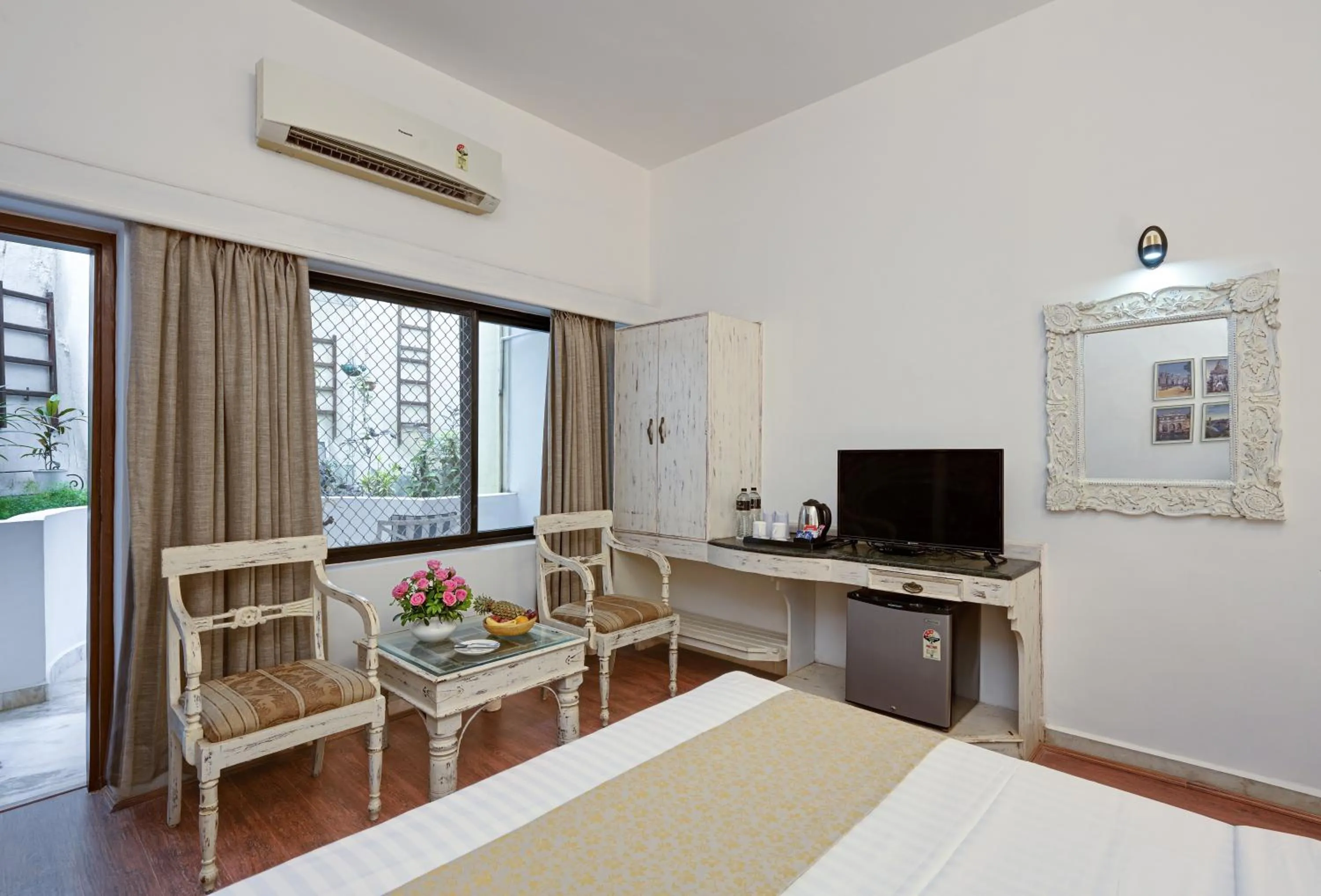 Seating area, Bed in Swaroop Vilas - Lake Facing Boutique Hotel