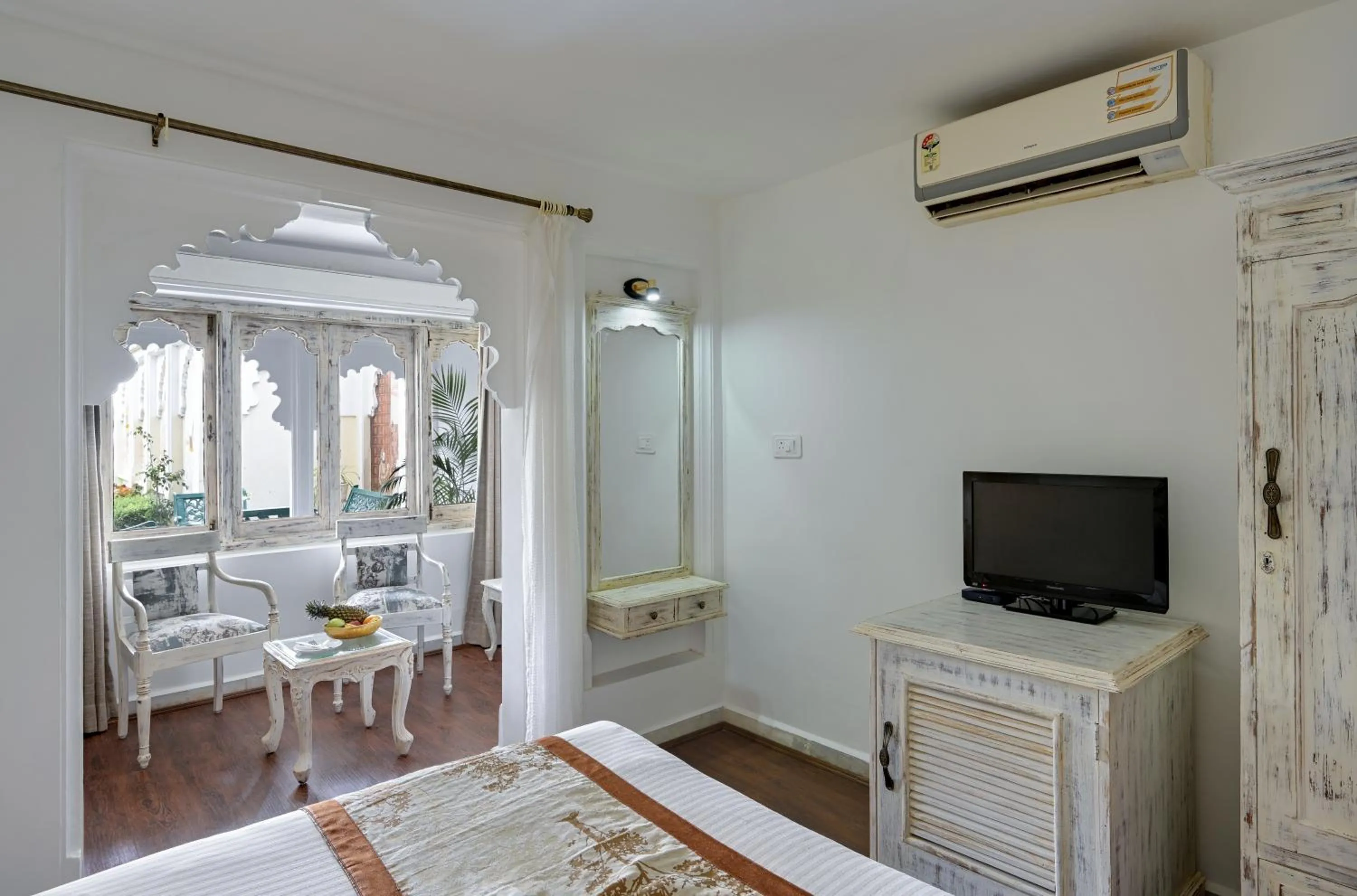 Seating area, Bed in Swaroop Vilas - Lake Facing Boutique Hotel