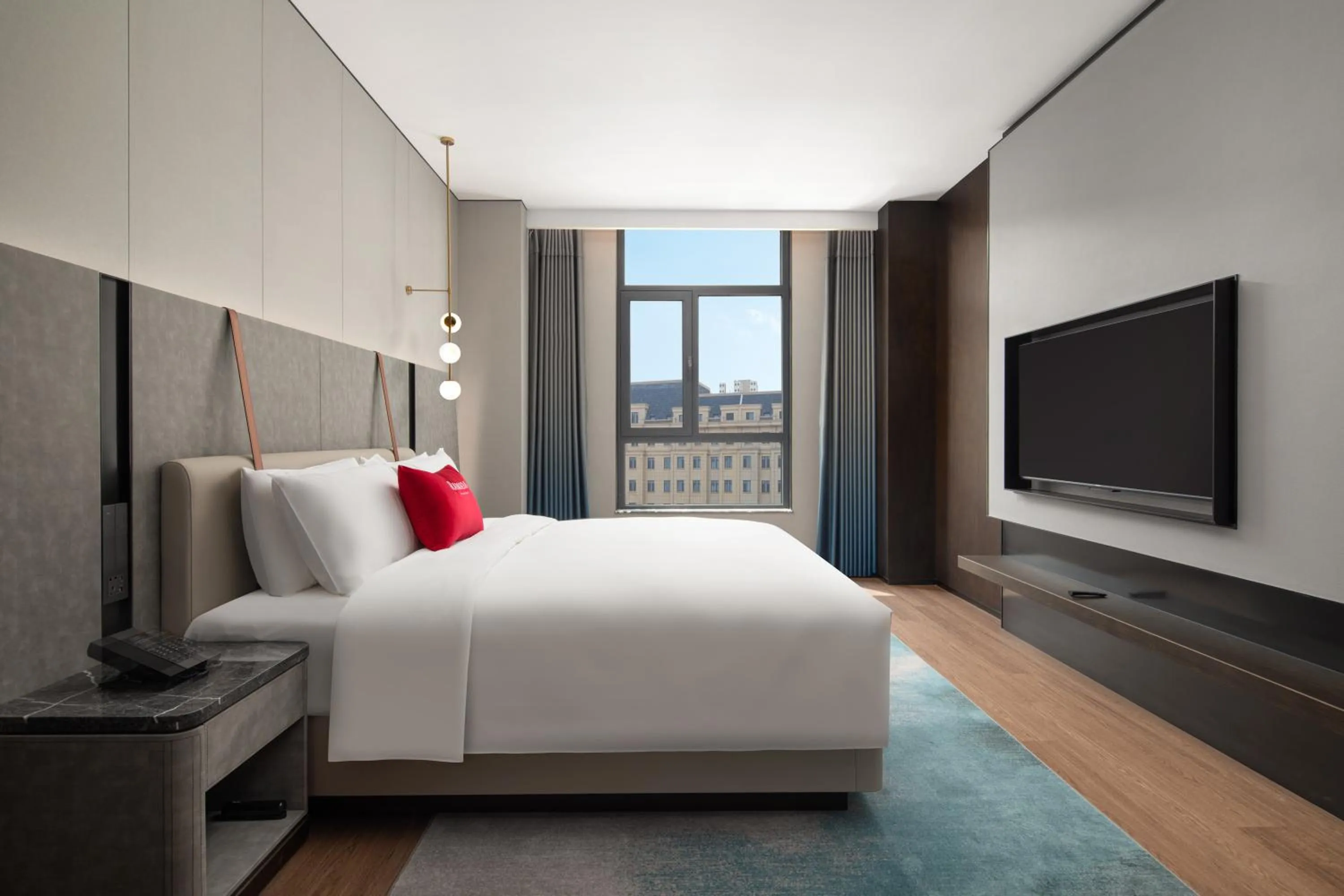 Bed in Ramada by Wyndham Qingdao Jiaodong International Airport