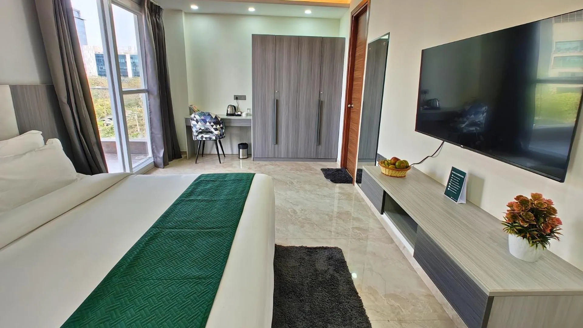 Communal lounge/ TV room, Bed in AVA Hotels and Corporates Millennium City