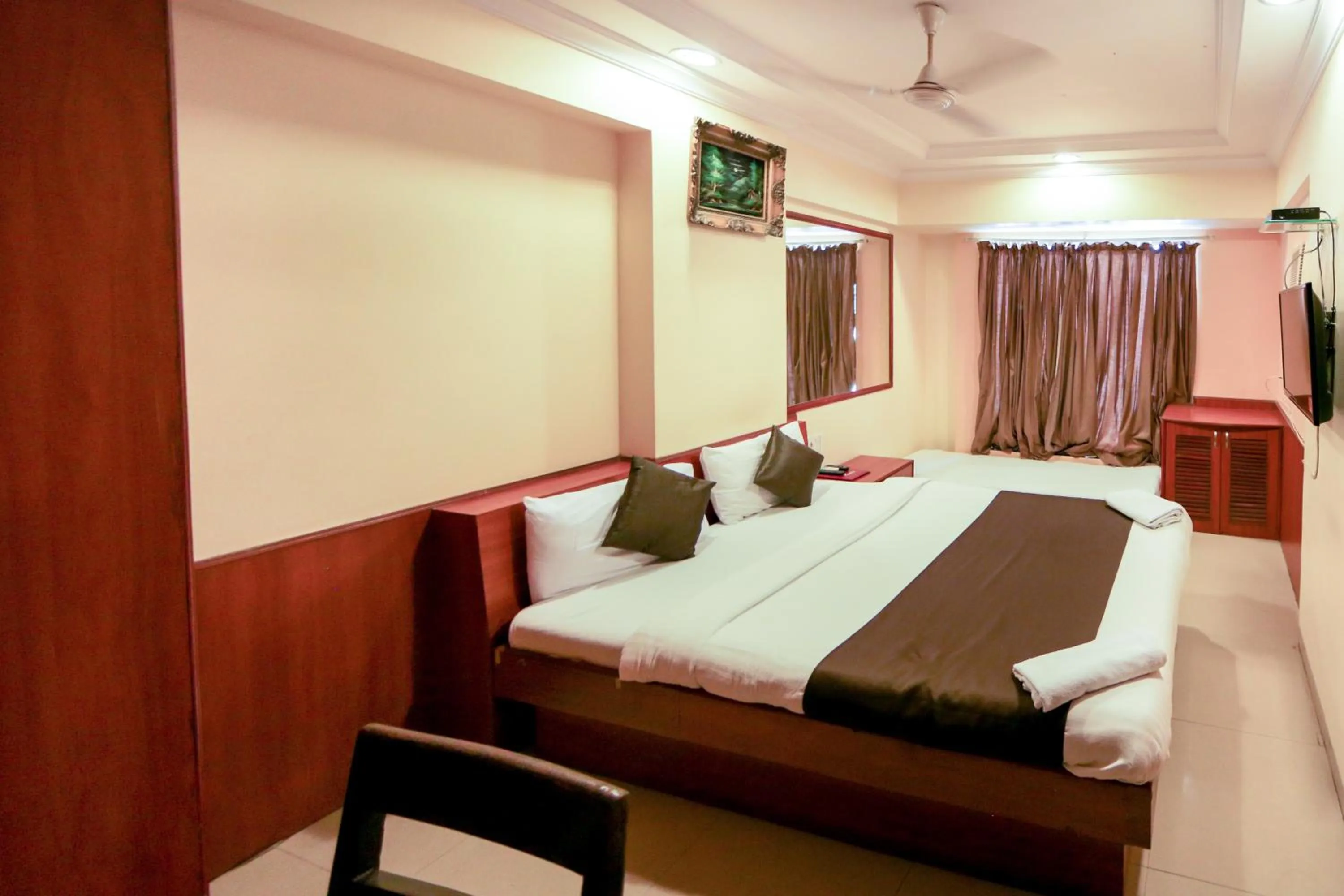 Photo of the whole room, Bed in Hotel Lucky Goregaon