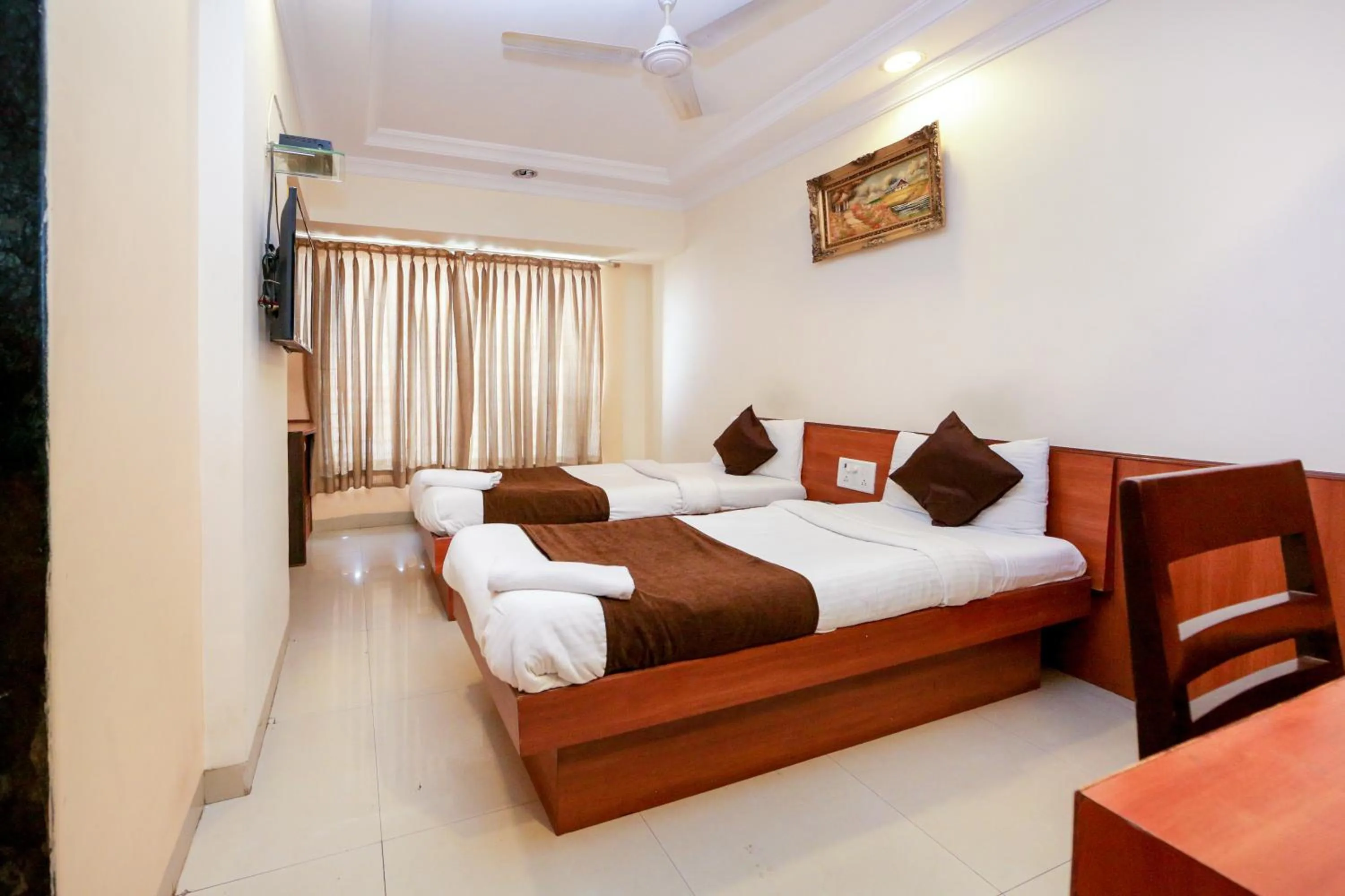 Photo of the whole room, Bed in Hotel Lucky Goregaon
