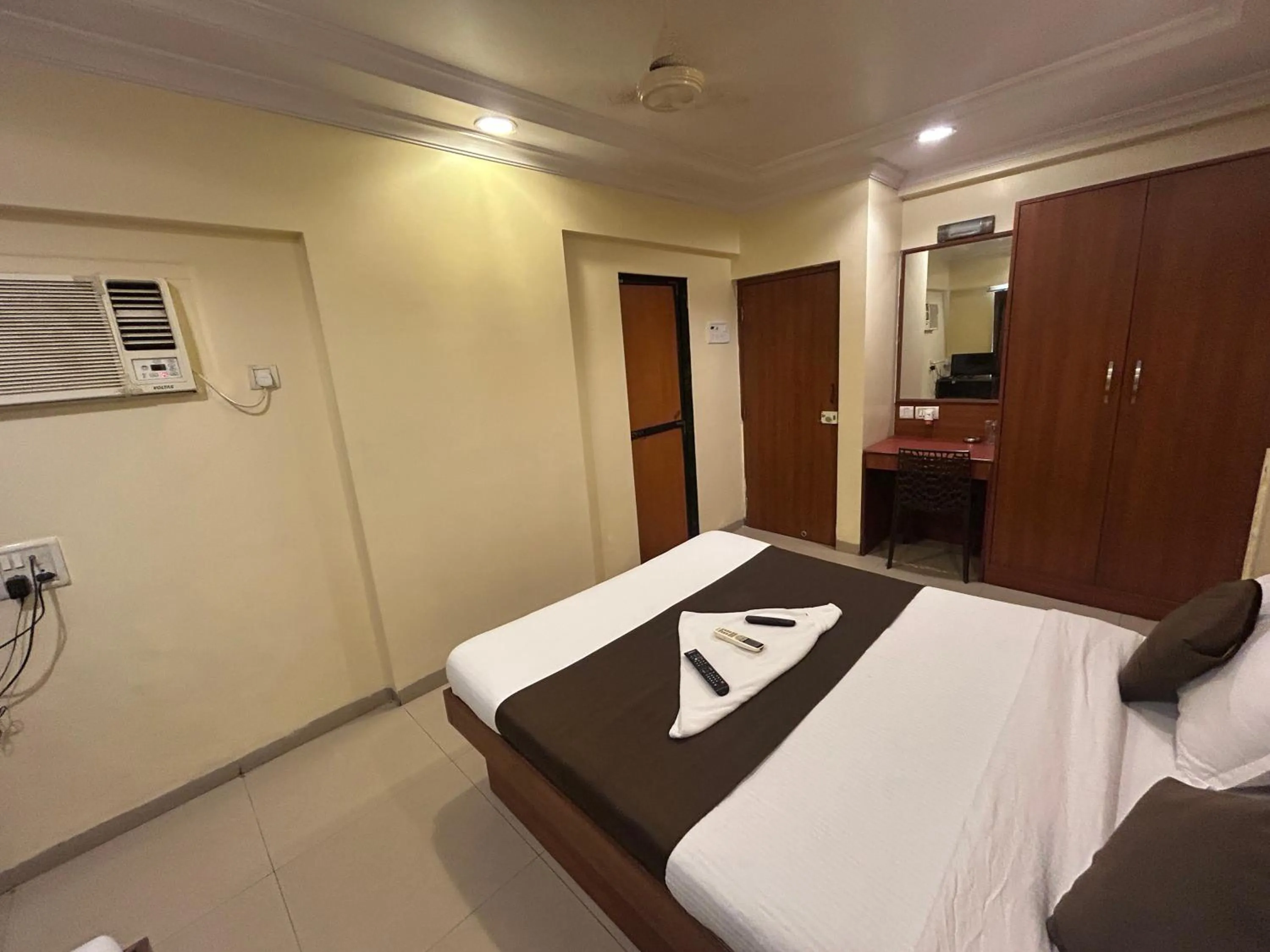 Photo of the whole room, Bed in Hotel Lucky Goregaon