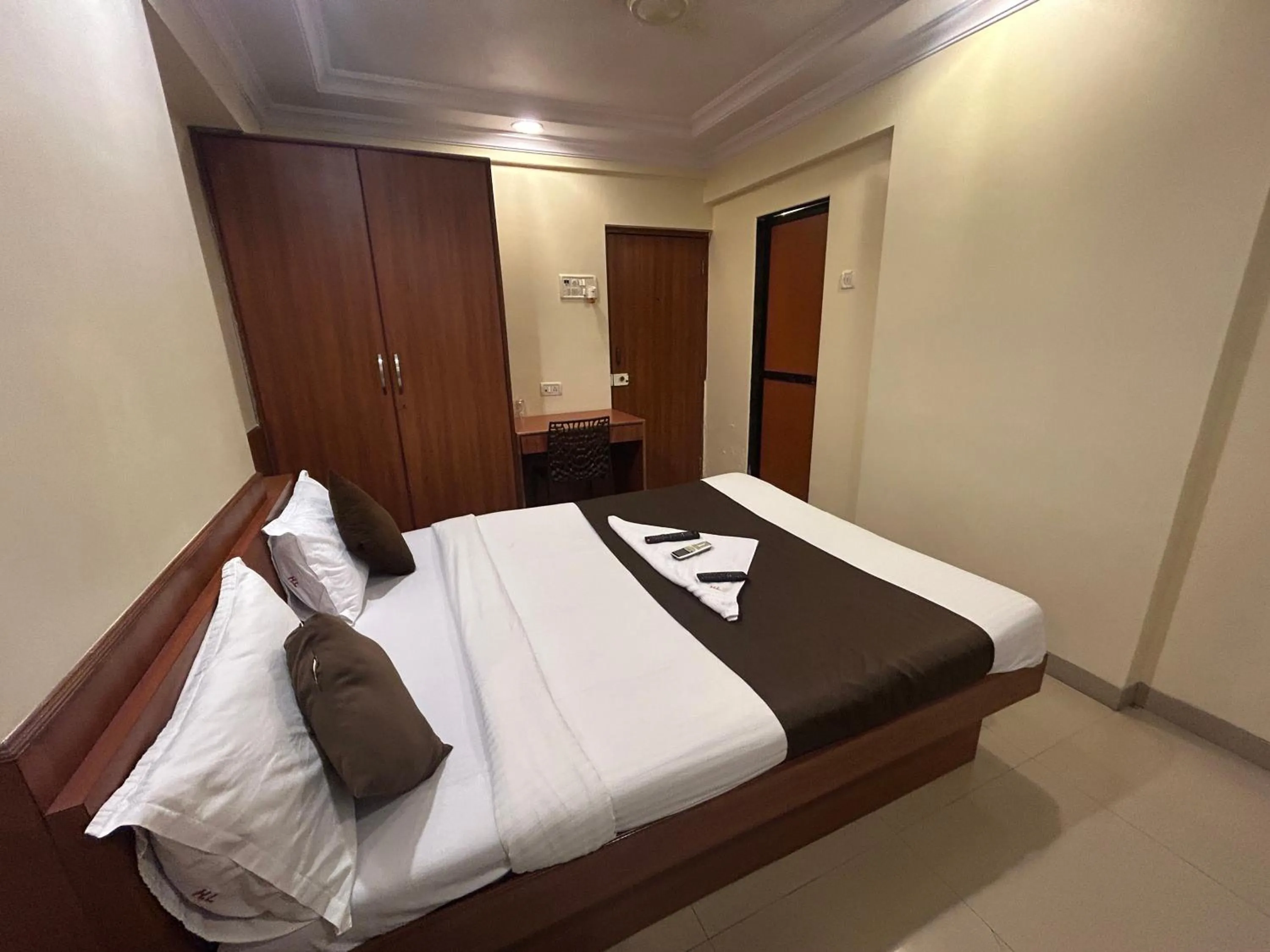 Photo of the whole room, Bed in Hotel Lucky Goregaon