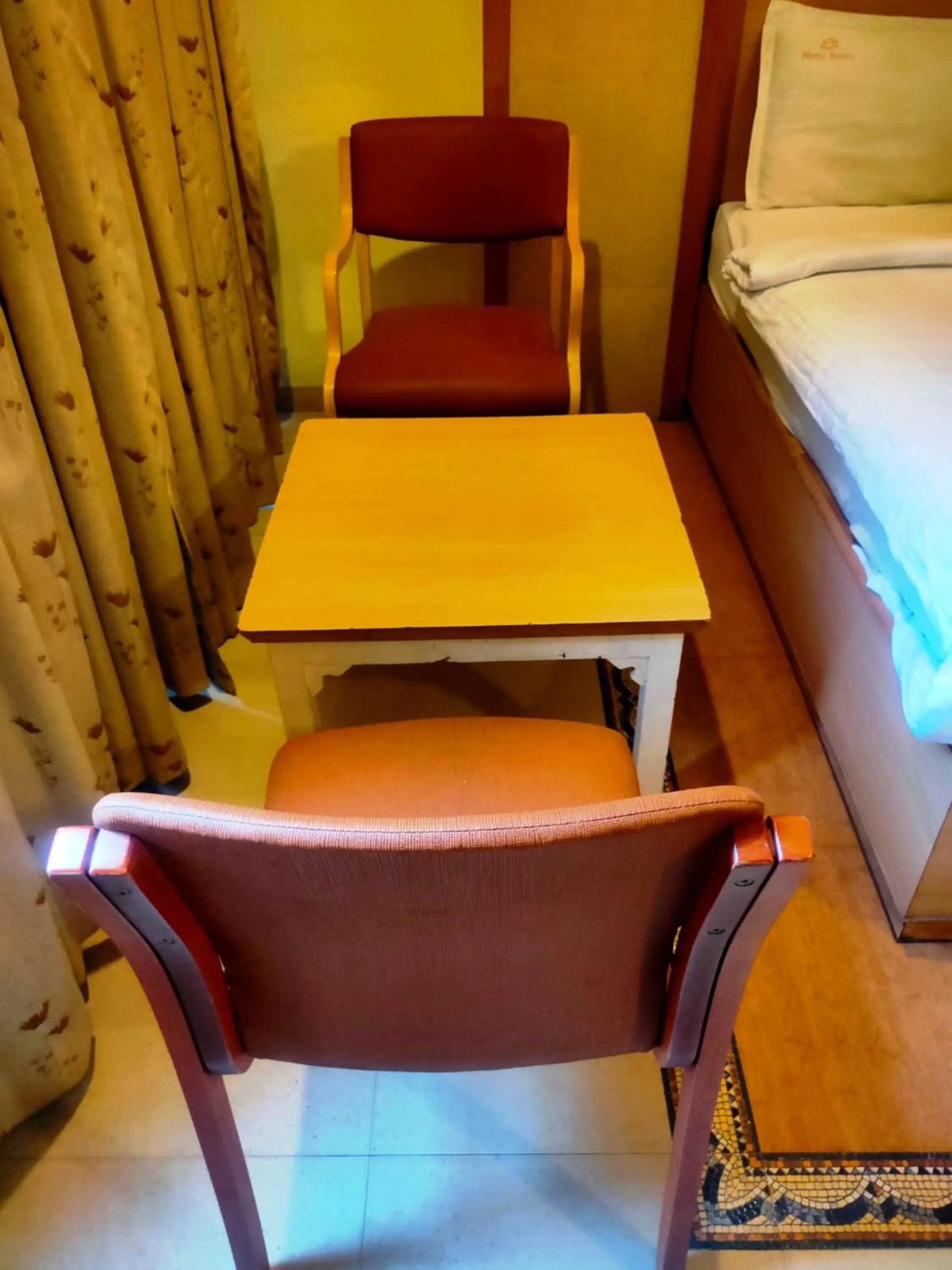 Seating area, Bed in Hotel Roopa