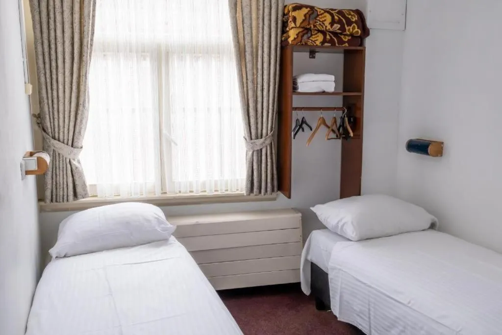 Bed in Budget Hotel Ben