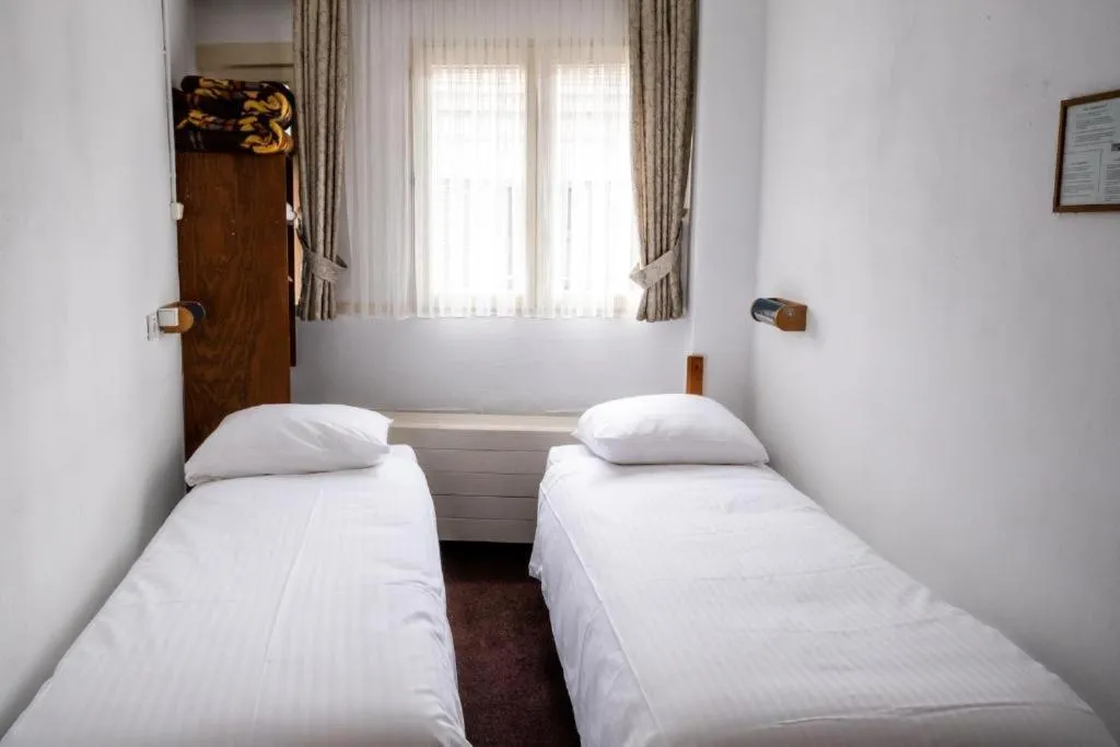 Bed in Budget Hotel Ben