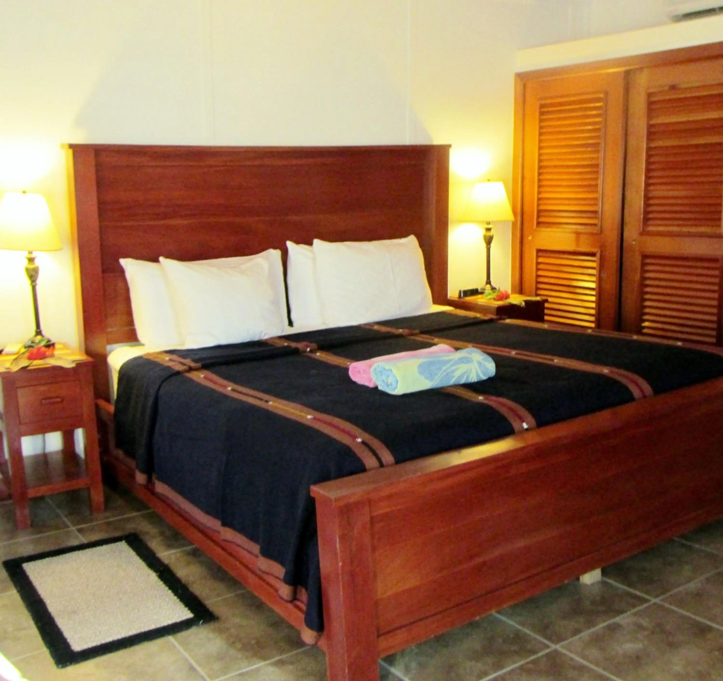 Bed in Cocotal Inn and Cabanas