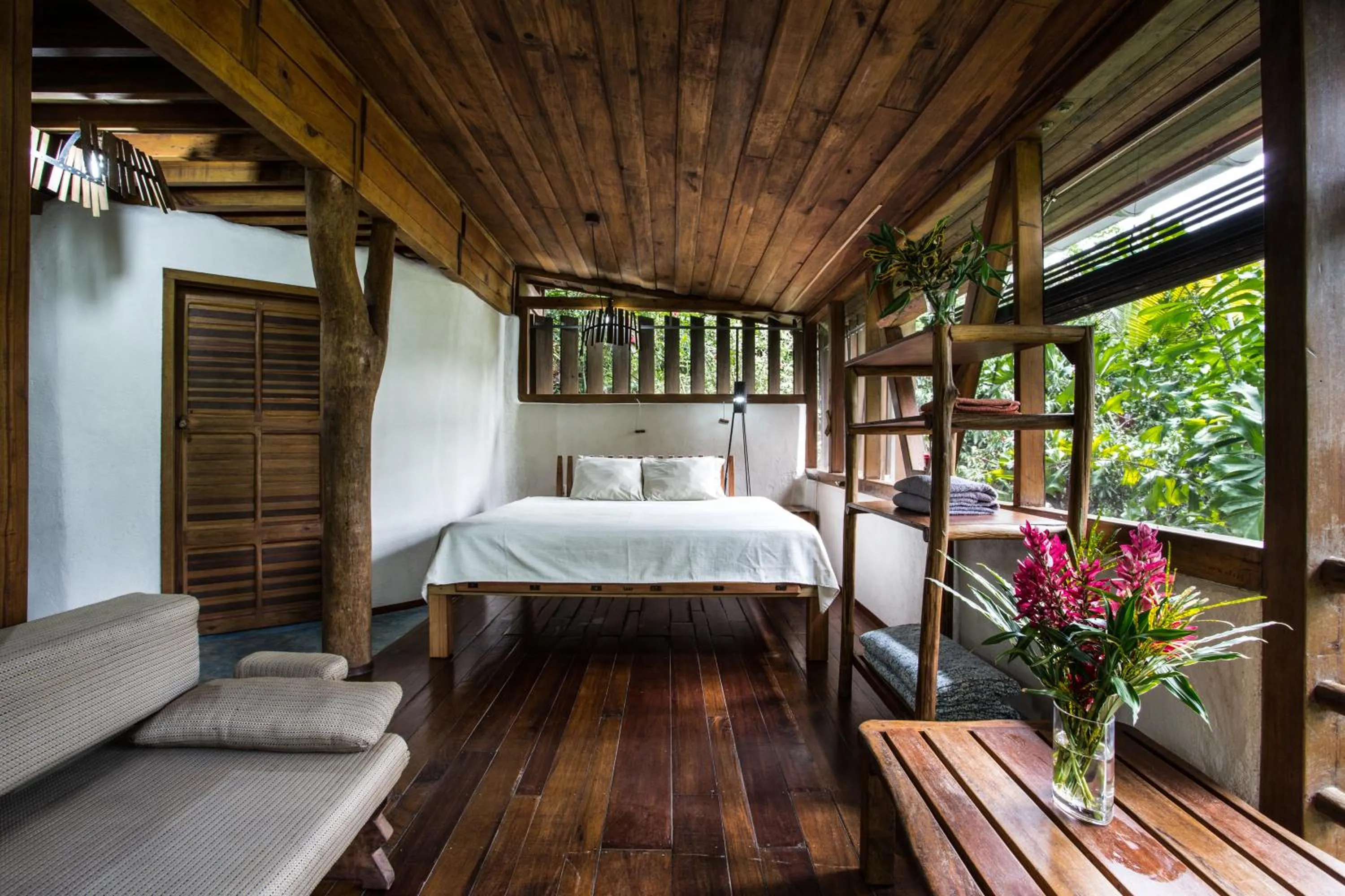 Bed in Omega Tours Eco-Jungle Lodge