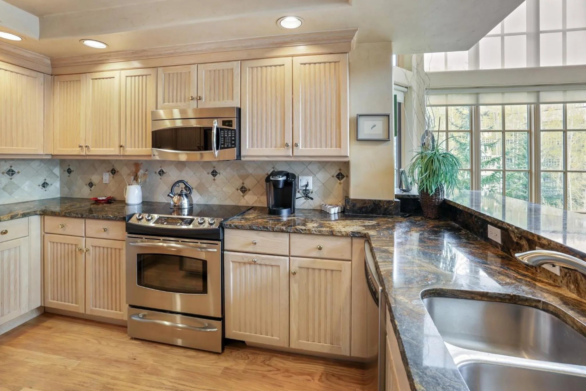 Communal kitchen in The Pines Lodge, a RockResort, by Vail Resorts